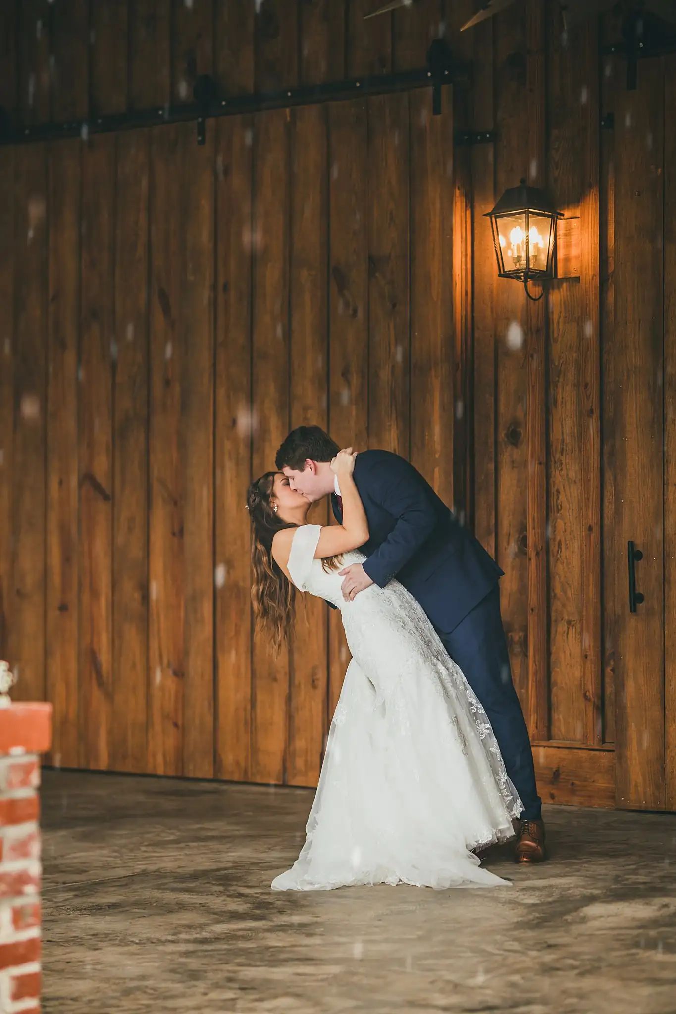 Barn at Harper Pines Wedding Thomaston, GA Atlanta Wedding Photographers Wedding Formals: the groom dipping the bride for a kiss, at their wedding at the Barn at Harper Pines in Thomaston, GA