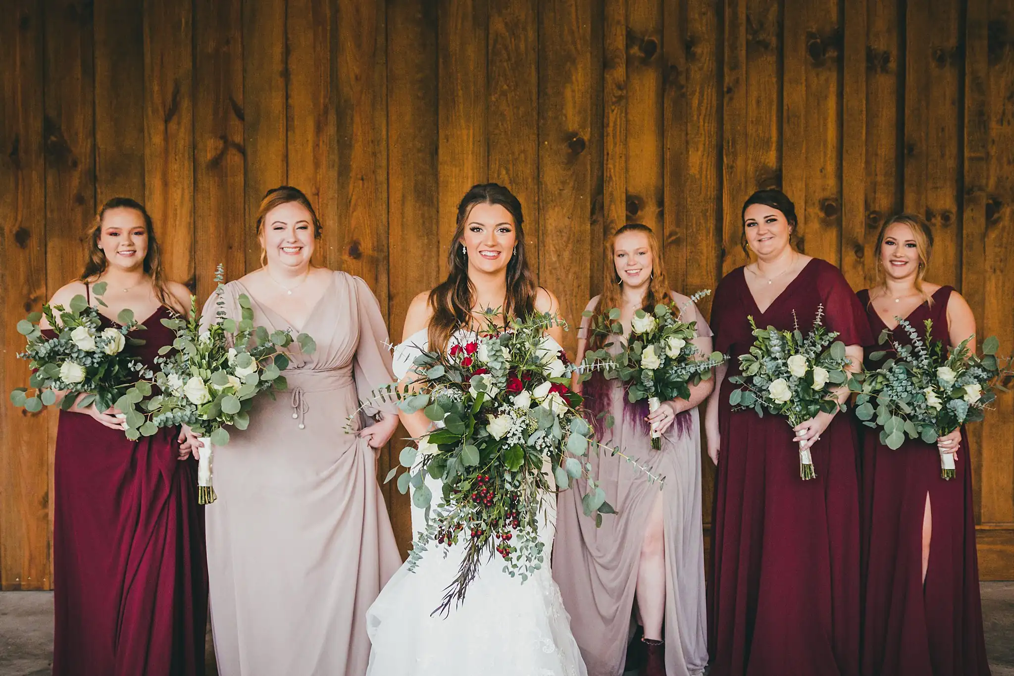 Barn at Harper Pines Wedding Thomaston, GA Atlanta Wedding Photographers Wedding Party: the bride and her bridesmaids with their bouquets, at their wedding at the Barn at Harper Pines in Thomaston, GA