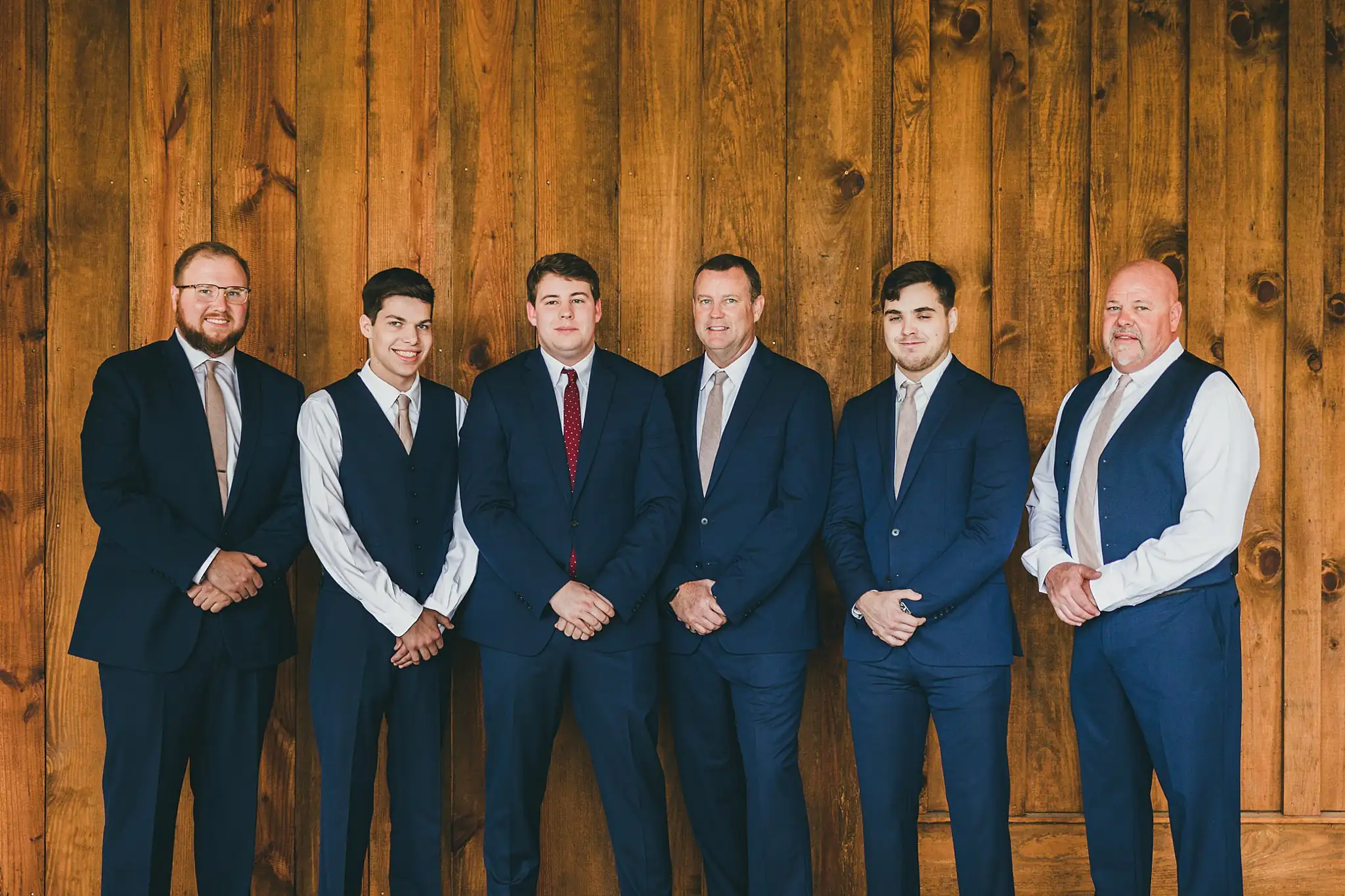 Barn at Harper Pines Wedding Thomaston, GA Atlanta Wedding Photographers Wedding Party: the groomsmen lined up in navy, at their wedding at the Barn at Harper Pines in Thomaston, GA
