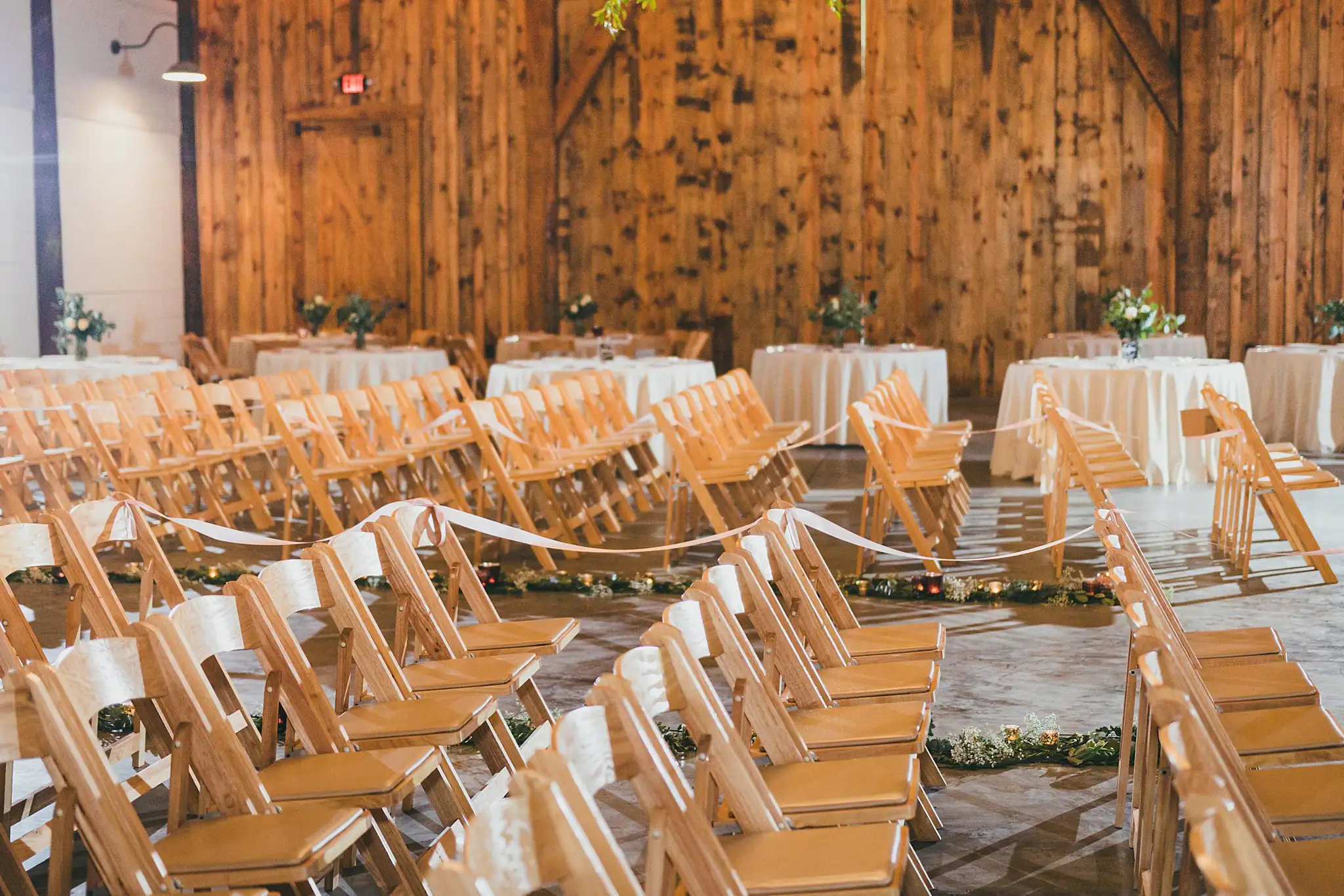 Barn at Harper Pines Wedding Thomaston, GA Atlanta Wedding Photographers Reception Details: the tables and chairs set in the barn, at a wedding at the Barn at Harper Pines in Thomaston, GA