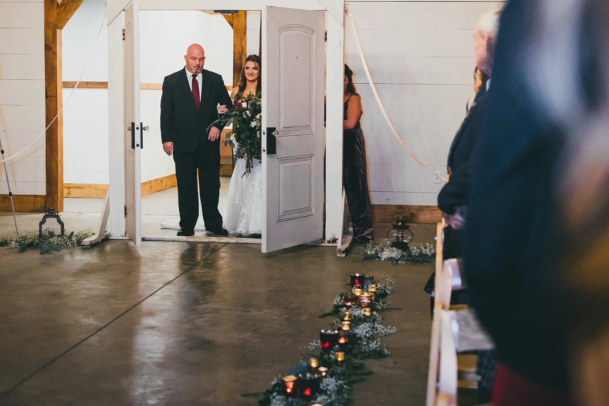 Barn at Harper Pines Wedding Thomaston, GA Atlanta Wedding Photographers Processional: the doors opening on the bride and her father, at their wedding at the Barn at Harper Pines in Thomaston, GA