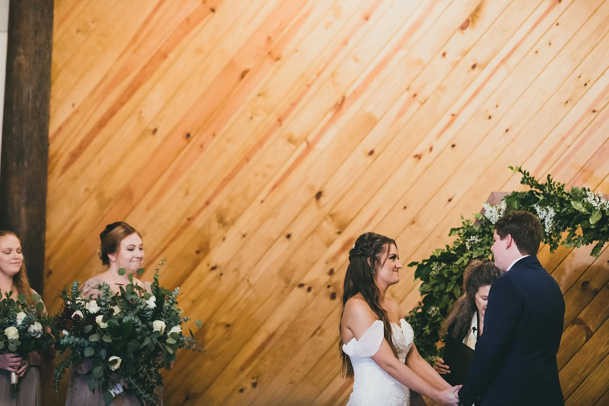 Barn at Harper Pines Wedding Thomaston, GA Atlanta Wedding Photographers Wedding Ceremony: the bride during the vows, at their wedding at the Barn at Harper Pines in Thomaston, GA
