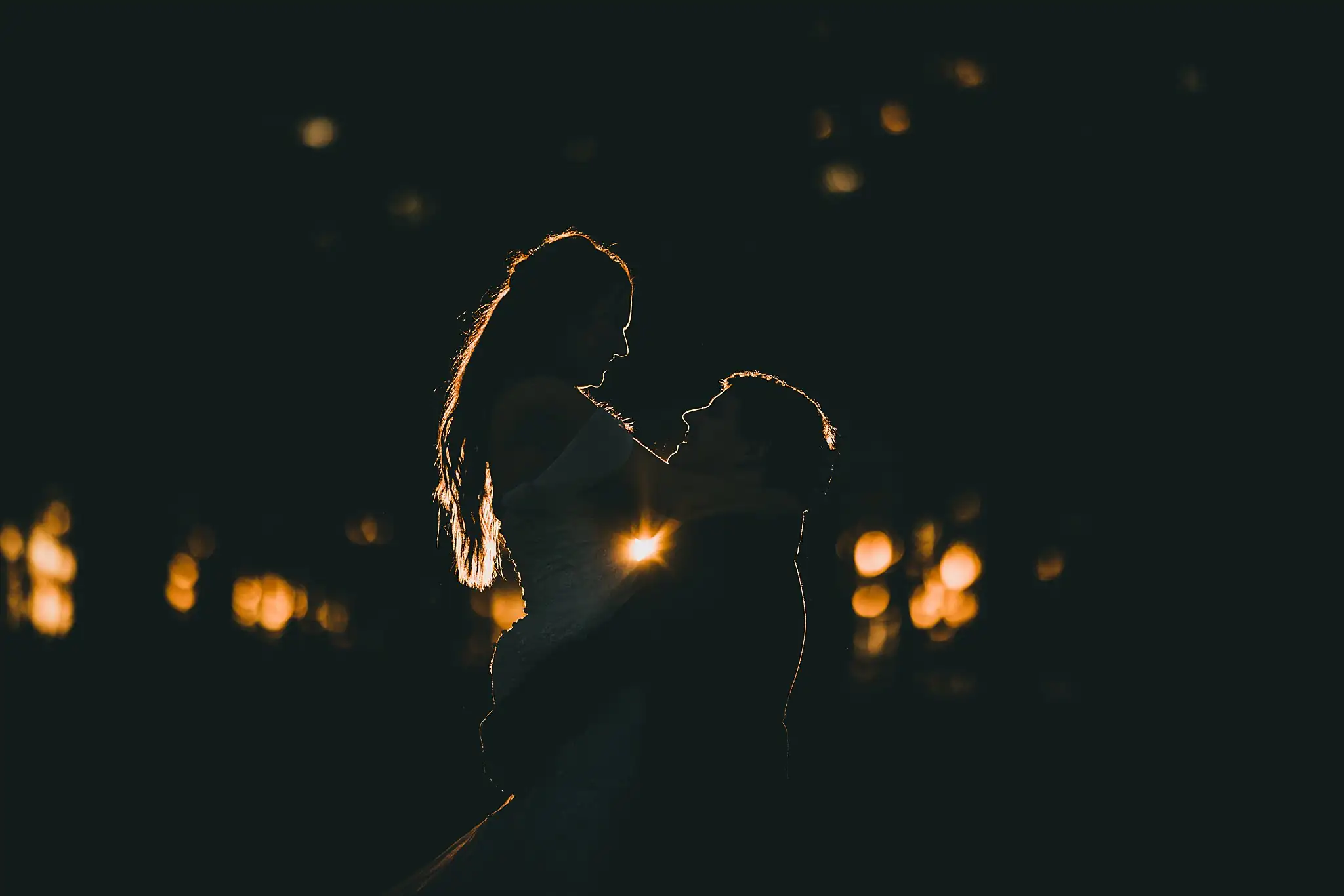 Barn at Harper Pines Wedding Thomaston, GA Atlanta Wedding Photographers Wedding Formals: the couple in silhouette after dark, at their wedding at the Barn at Harper Pines in Thomaston, GA