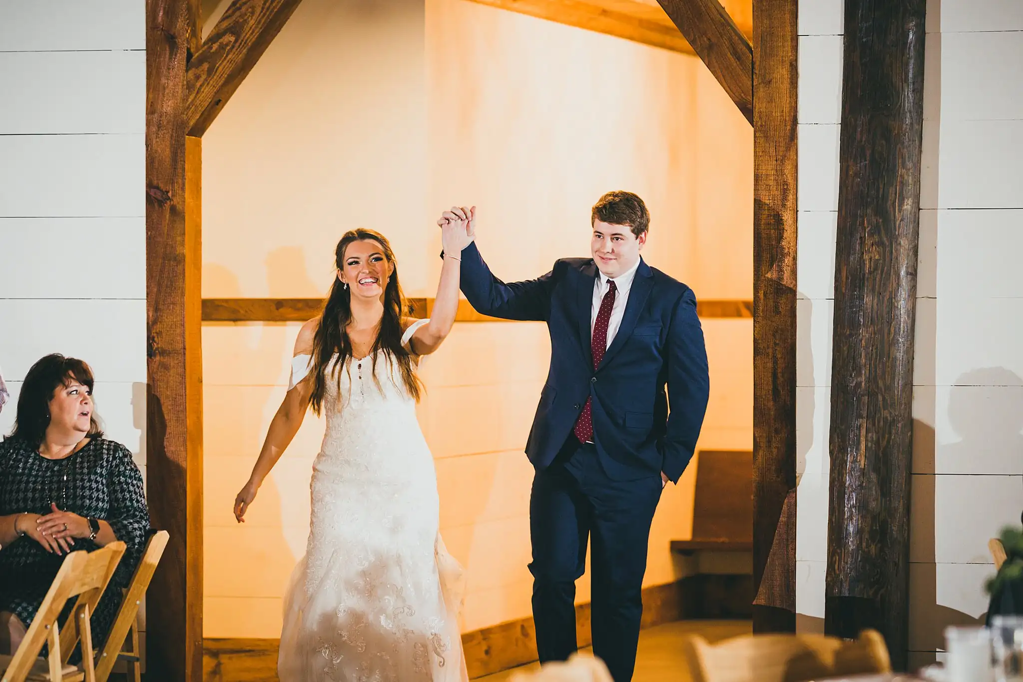 Barn at Harper Pines Wedding Thomaston, GA Atlanta Wedding Photographers Wedding Reception: the couple's grand entrance, at their wedding at the Barn at Harper Pines in Thomaston, GA
