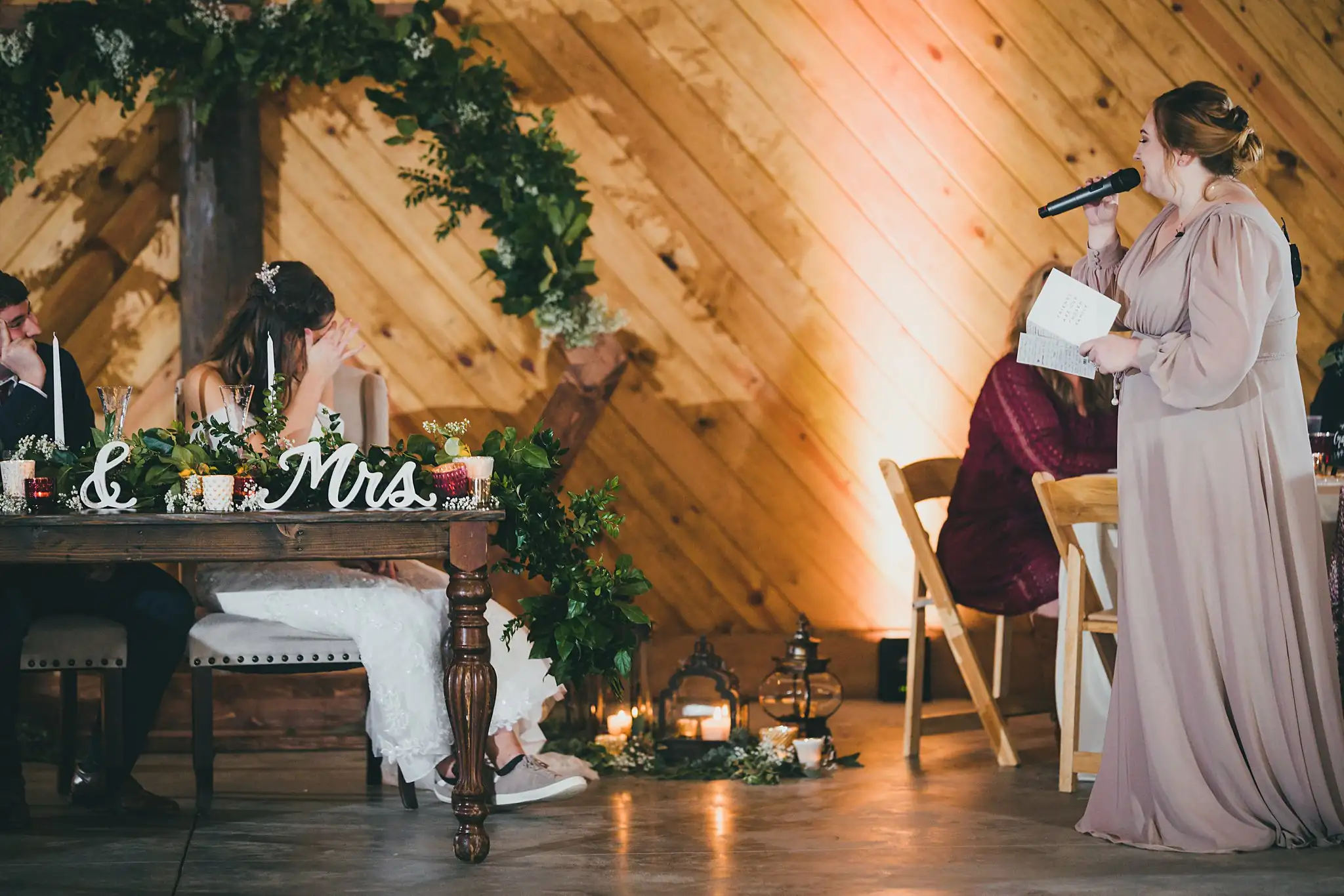 Barn at Harper Pines Wedding Thomaston, GA Atlanta Wedding Photographers Wedding Reception: a toast beside the sweetheart table, at their wedding at the Barn at Harper Pines in Thomaston, GA