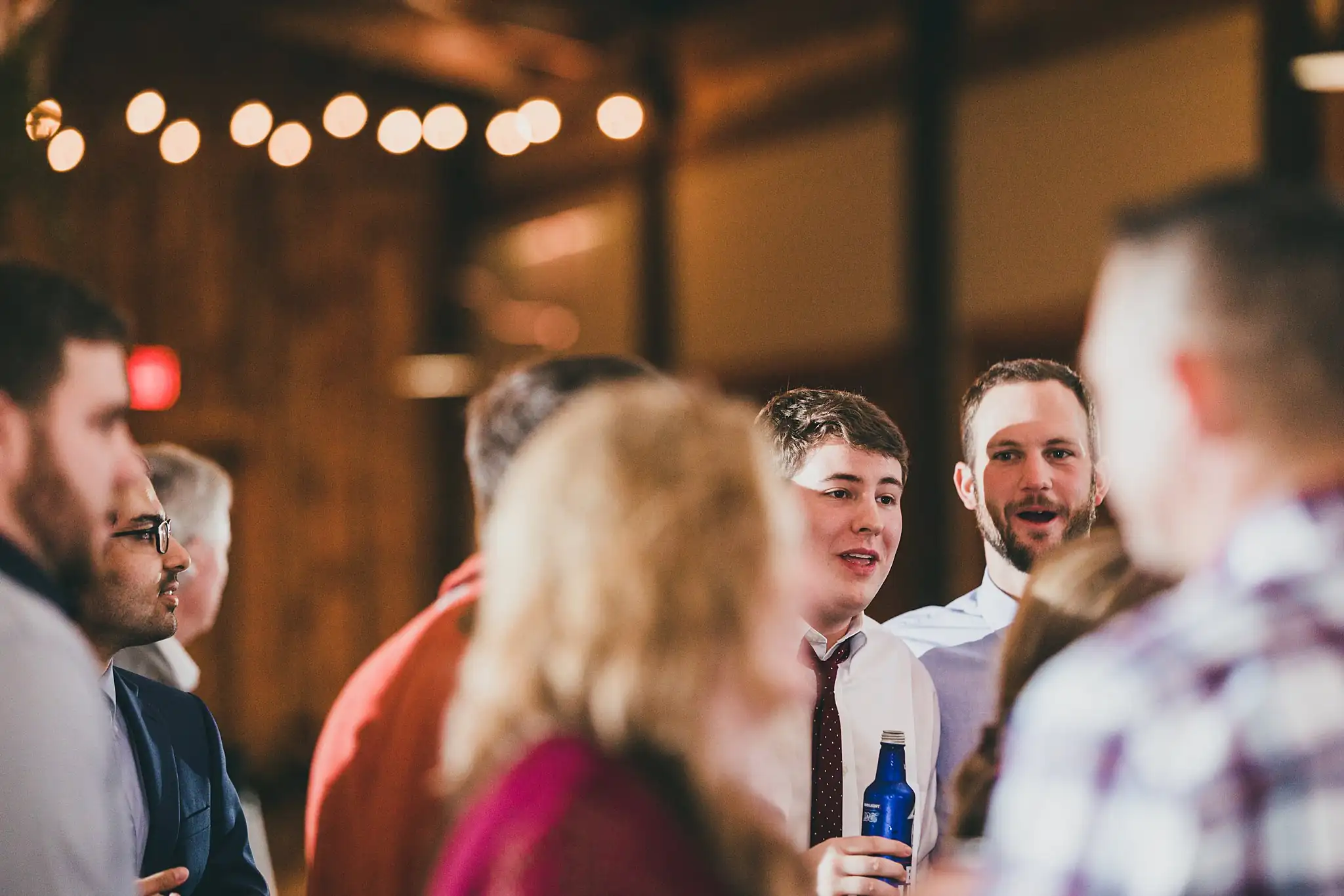 Barn at Harper Pines Wedding Thomaston, GA Atlanta Wedding Photographers Wedding Reception: guests talking together, at their wedding at the Barn at Harper Pines in Thomaston, GA