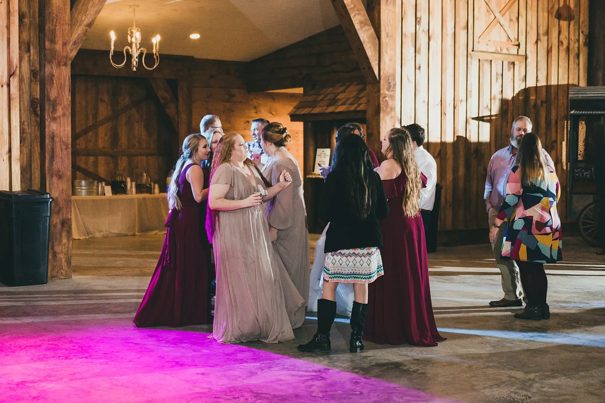 Barn at Harper Pines Wedding Thomaston, GA Atlanta Wedding Photographers Wedding Reception: guests gathering for the bouquet toss, at their wedding at the Barn at Harper Pines in Thomaston, GA