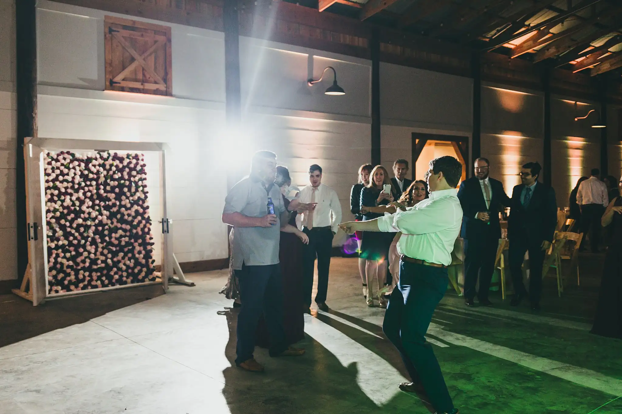 Barn at Harper Pines Wedding Thomaston, GA Atlanta Wedding Photographers Wedding Reception: guests dancing under the lights, at their wedding at the Barn at Harper Pines in Thomaston, GA