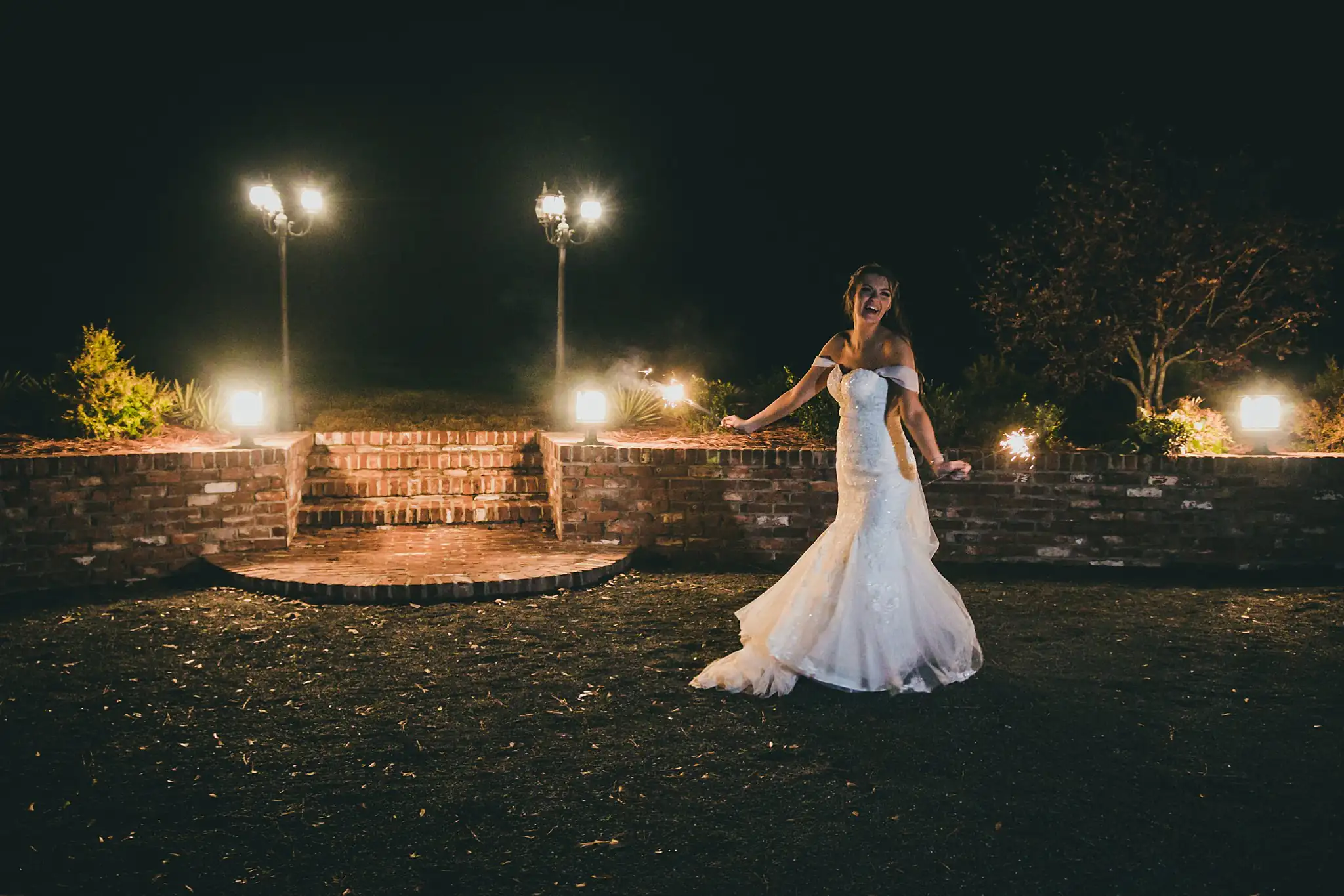 Barn at Harper Pines Wedding Thomaston, GA Atlanta Wedding Photographers Bridal Portraits: the bride on the patio after dark, at their wedding at the Barn at Harper Pines in Thomaston, GA