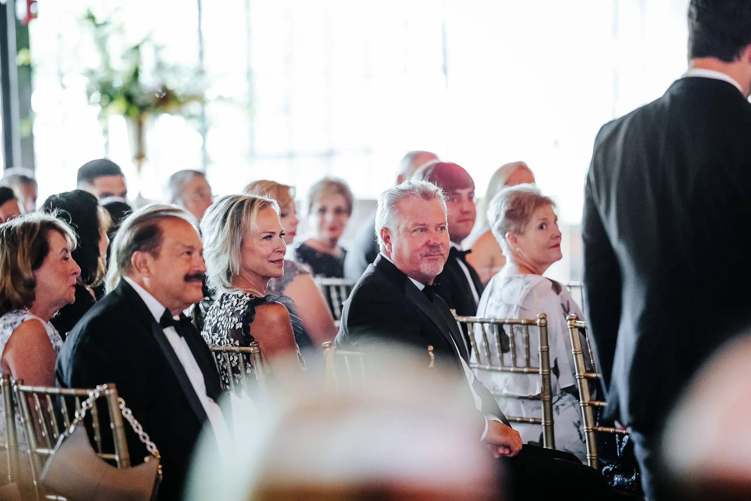 Wedding Ceremony: guests watching from their seats, at their wedding at Summerour Studio in Atlanta, GA