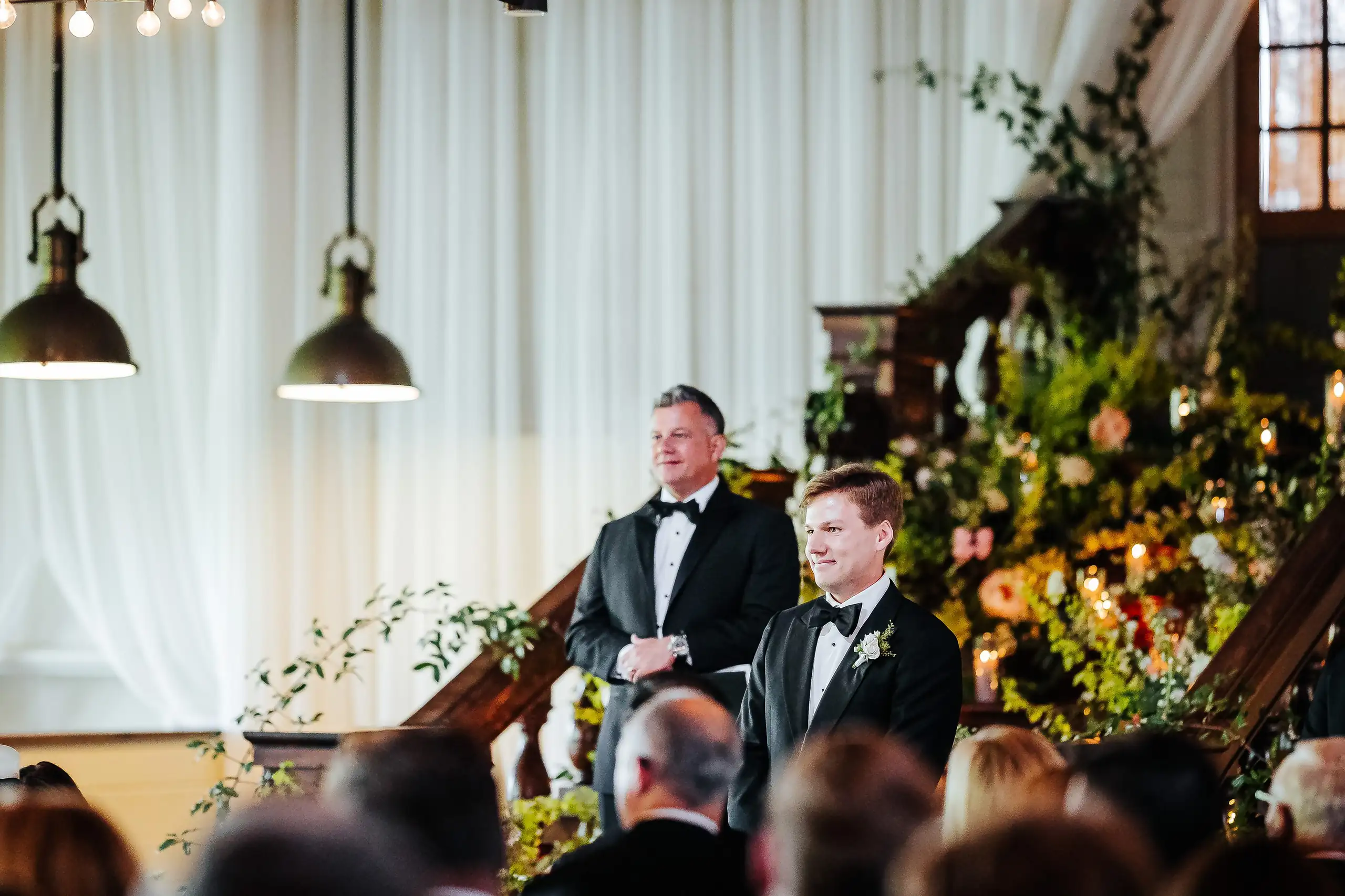 Wedding Ceremony: the groom watching his bride come down the aisle, at their wedding at Summerour Studio in Atlanta, GA