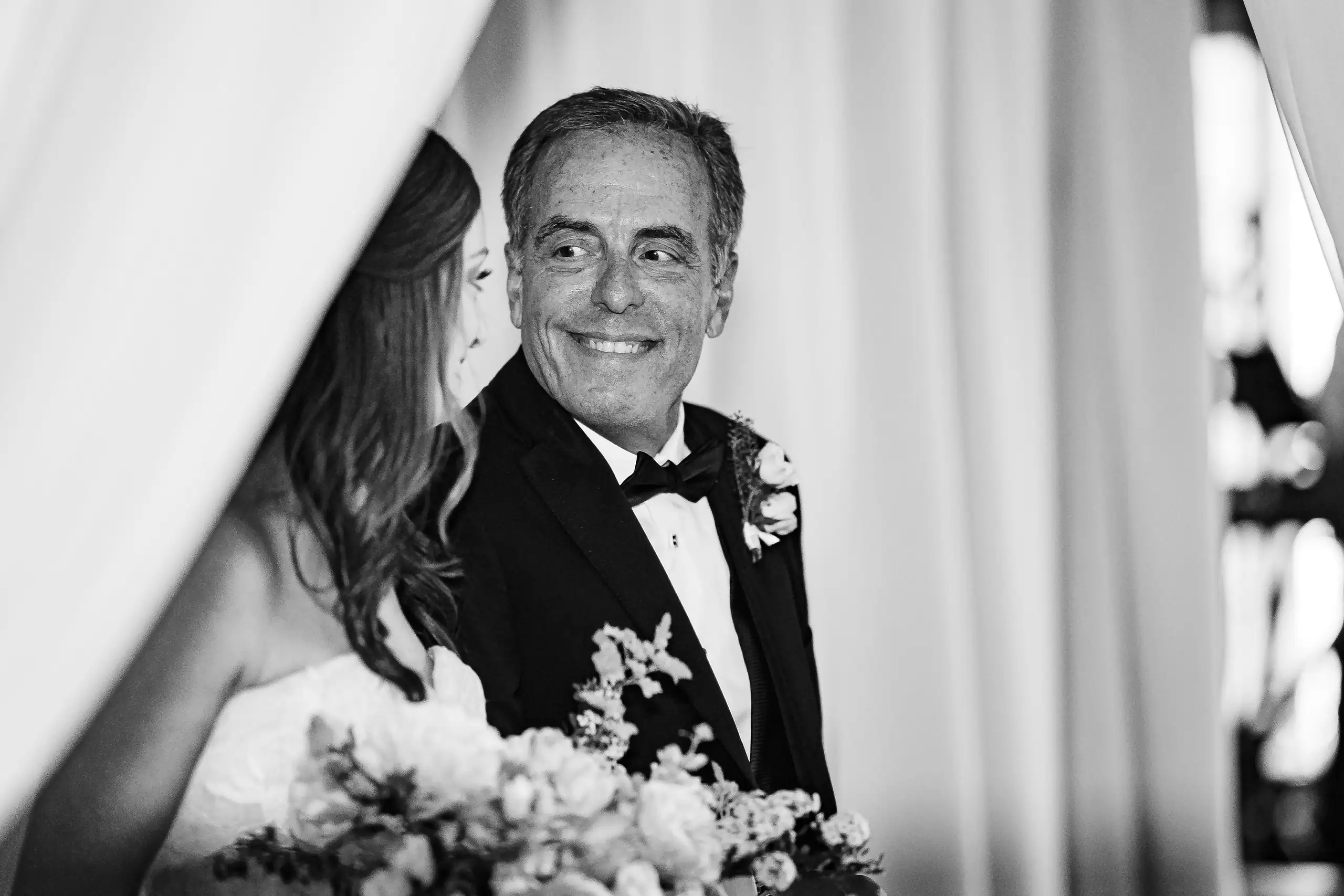 Wedding Ceremony: the bride's father during the ceremony, in black and white, at their wedding at Summerour Studio in Atlanta, GA