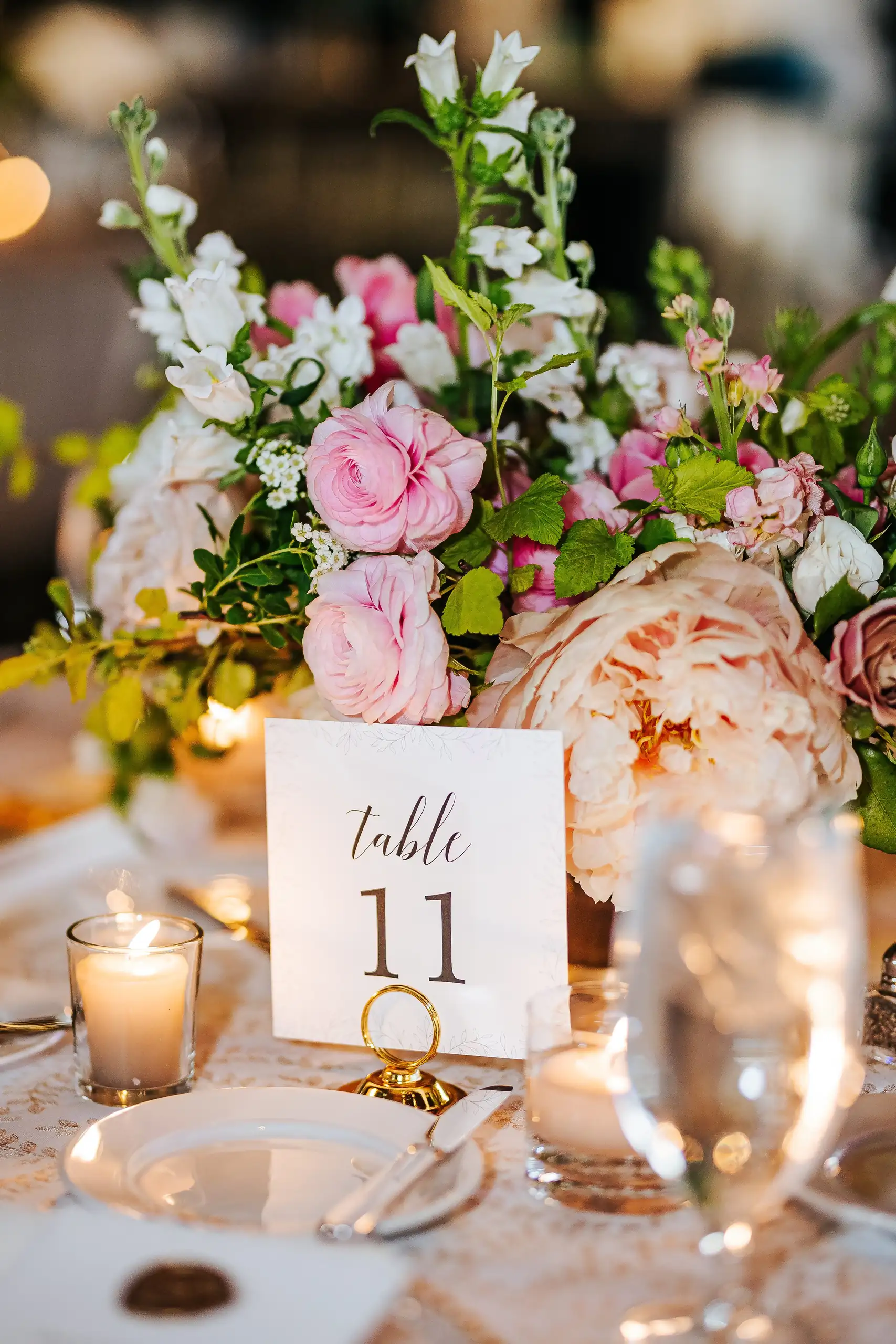 Reception Details: a table number set among the flowers, at a wedding at Summerour Studio in Atlanta, GA