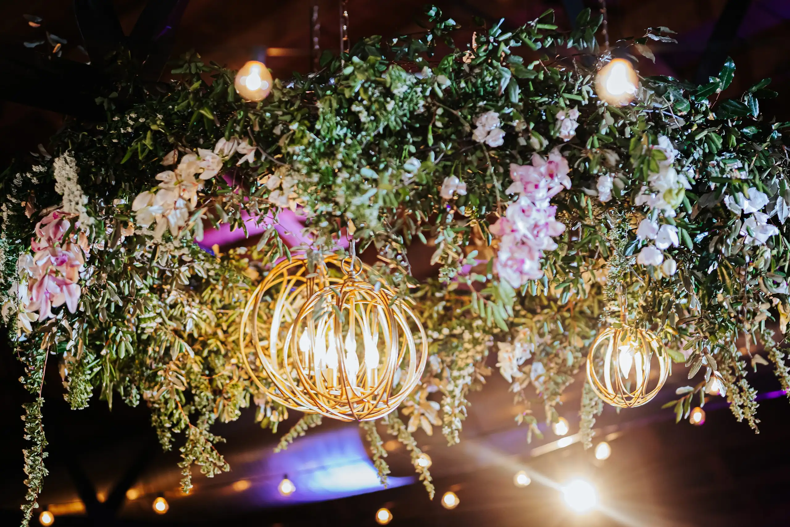 Reception Details: the suspended flower installation with gold orb lights, at a wedding at Summerour Studio in Atlanta, GA