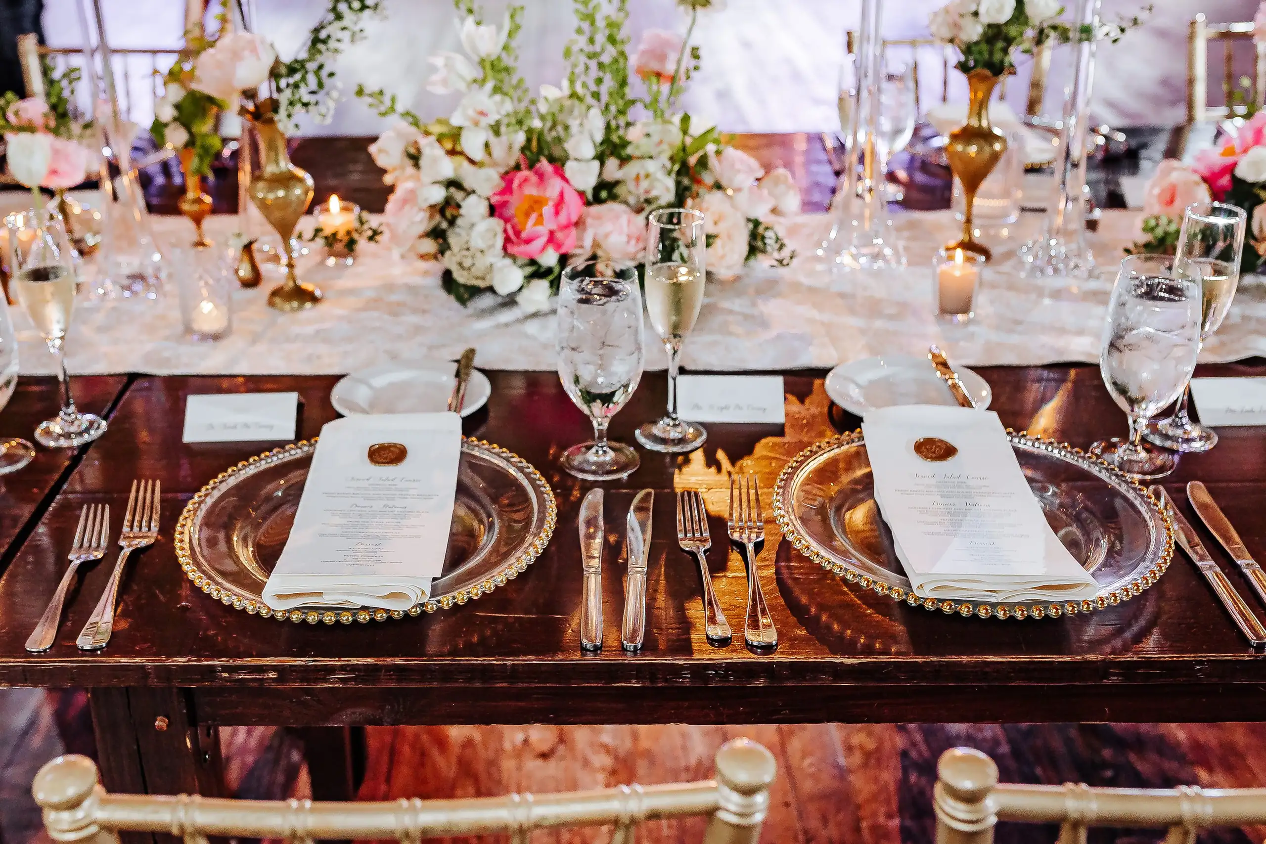 Reception Details: gold chargers and menus set down the table, at a wedding at Summerour Studio in Atlanta, GA