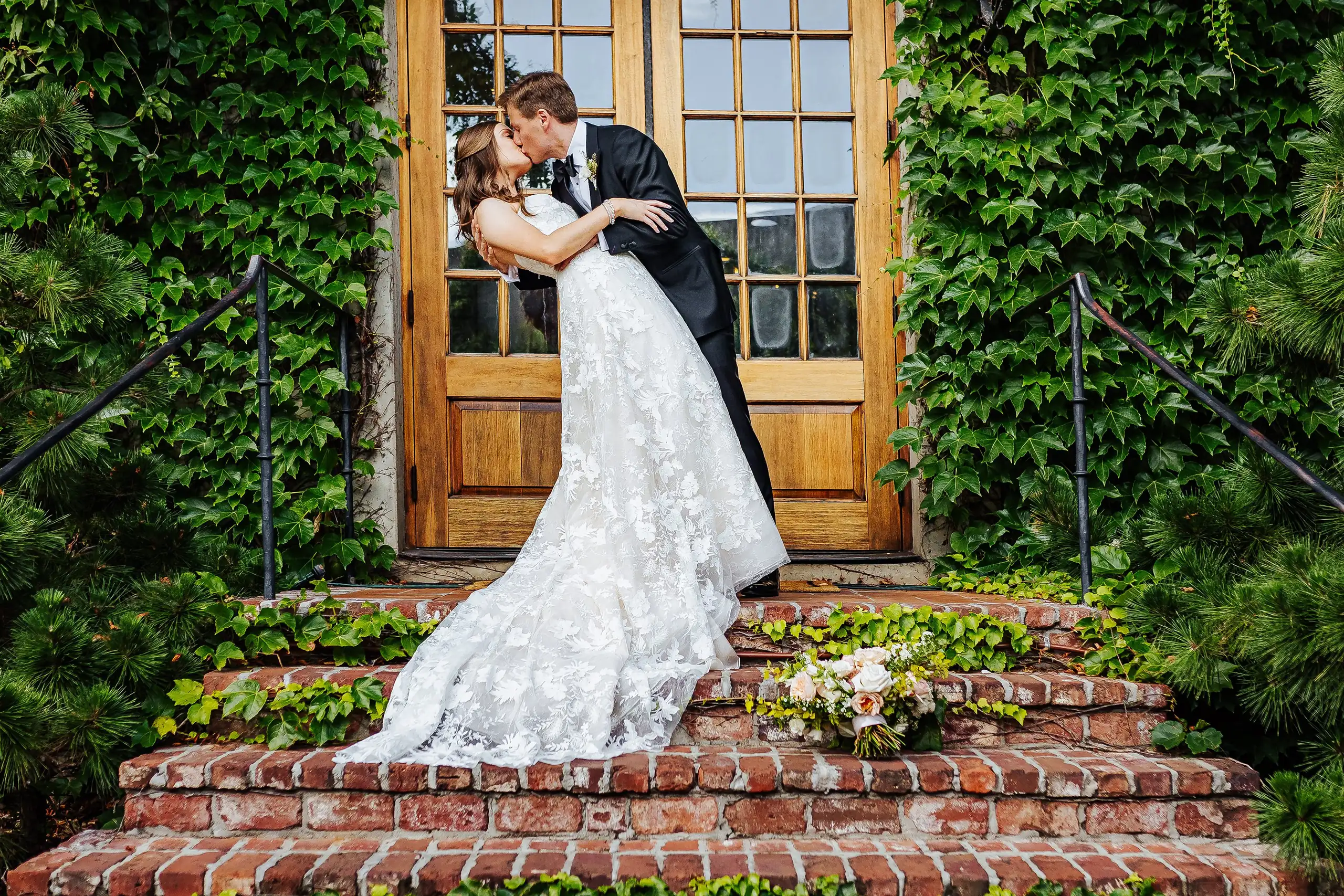 Wedding Formals: the groom dipping the bride on the brick steps, at their wedding at Summerour Studio in Atlanta, GA