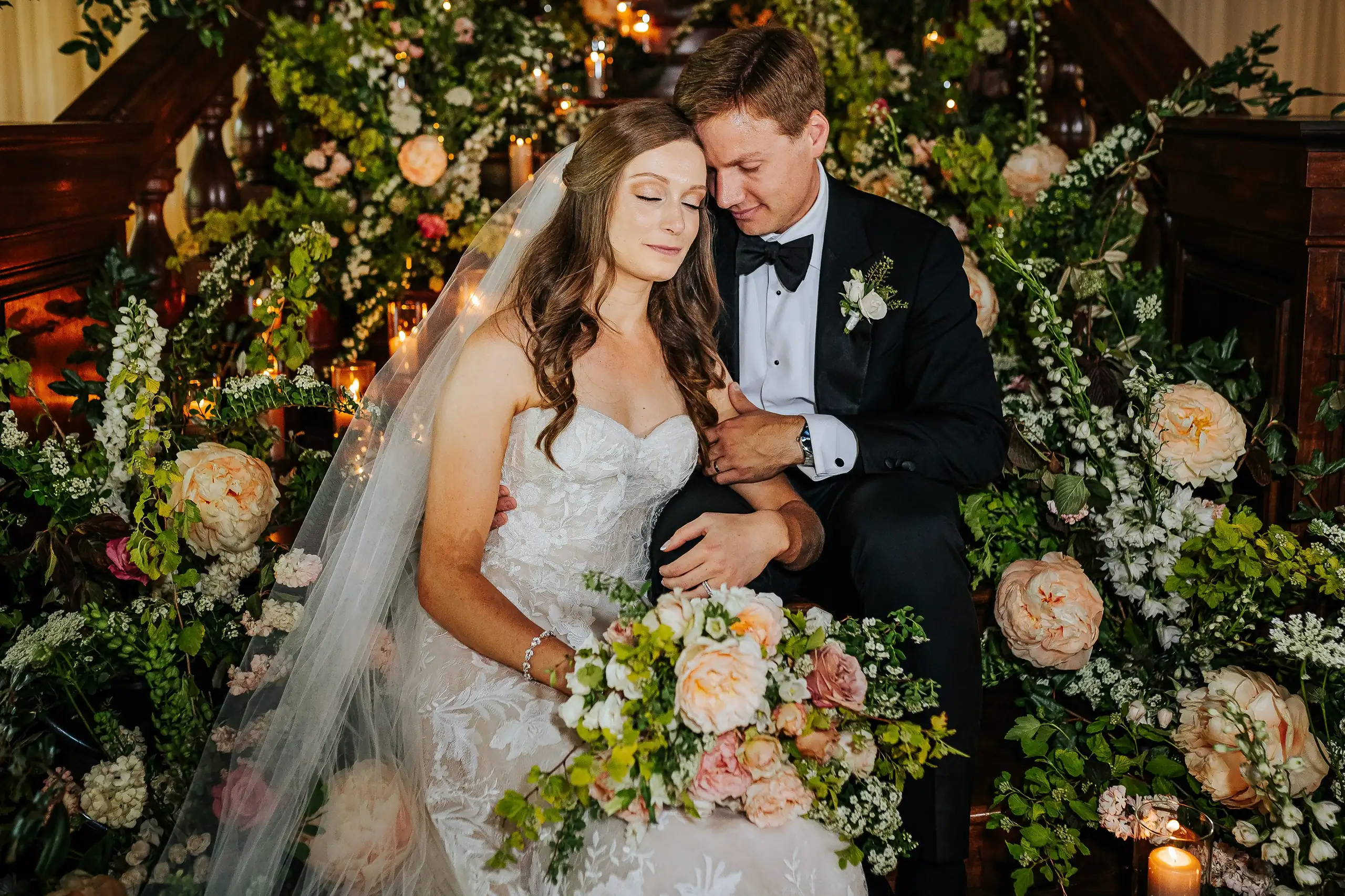 Wedding Formals: the couple on the stairs with the bride's bouquet, at their wedding at Summerour Studio in Atlanta, GA