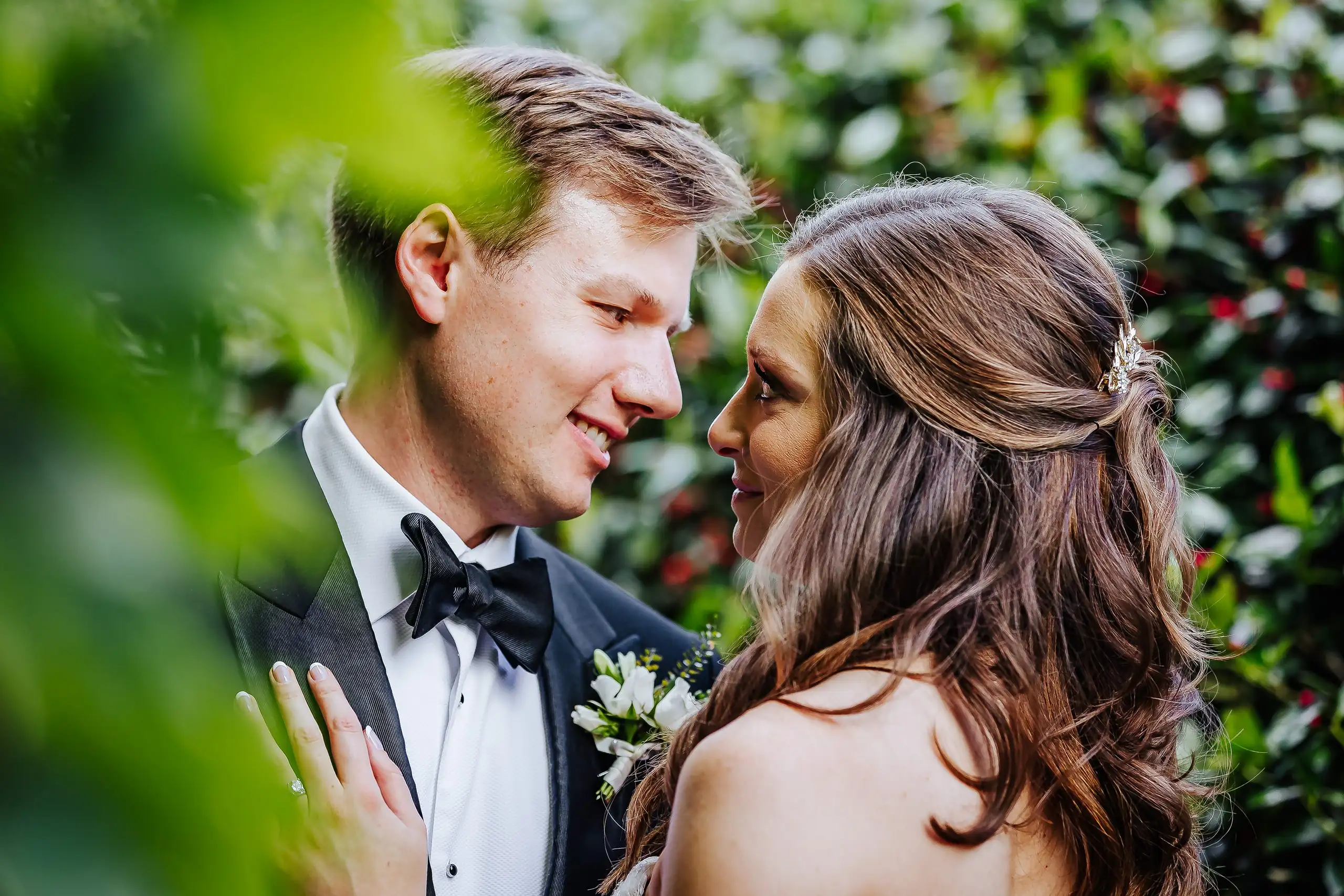 Wedding Formals: the couple close together in the greenery, at their wedding at Summerour Studio in Atlanta, GA