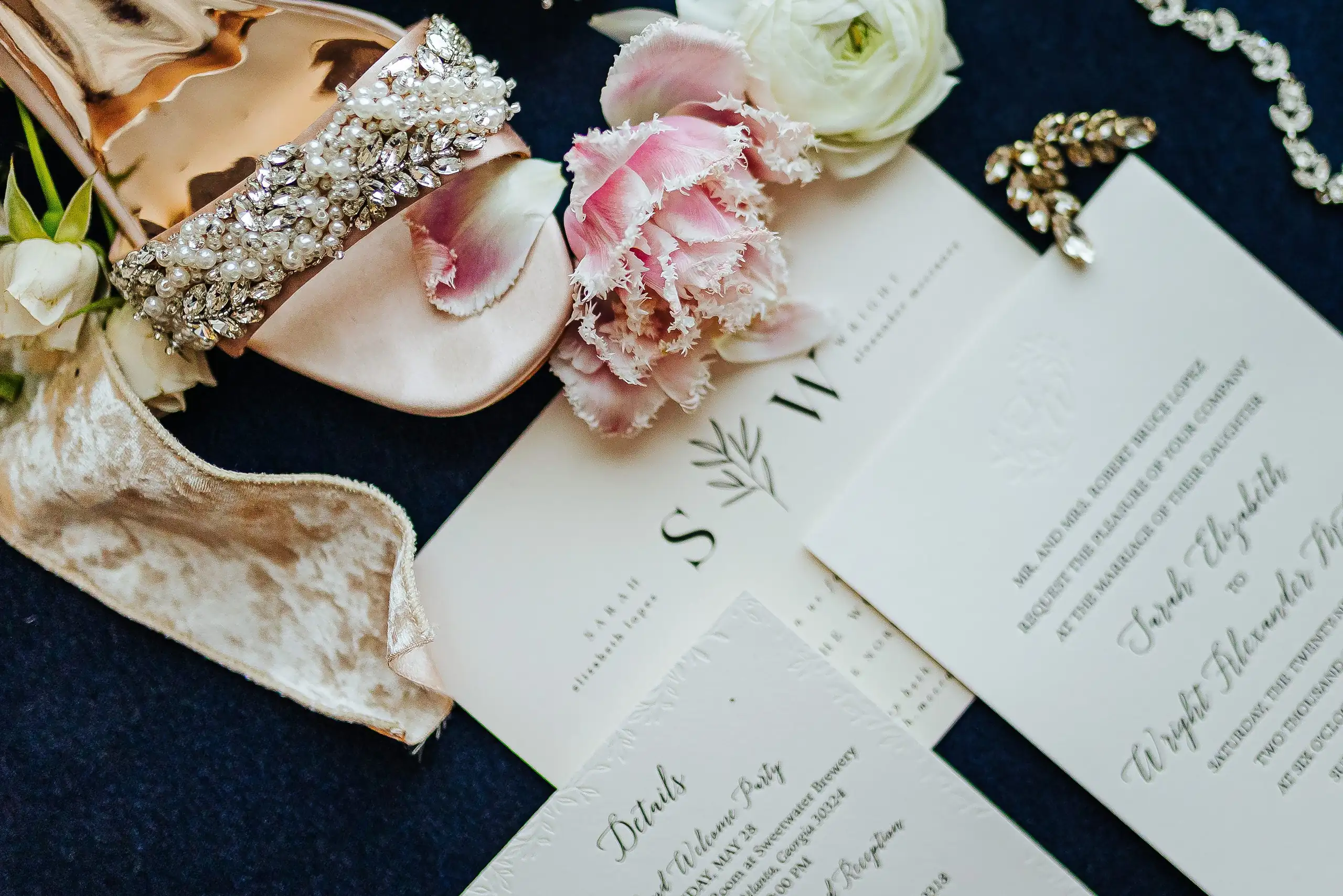 Wedding Details: shoes, stationery and peonies on navy velvet, at a wedding at Summerour Studio in Atlanta, GA