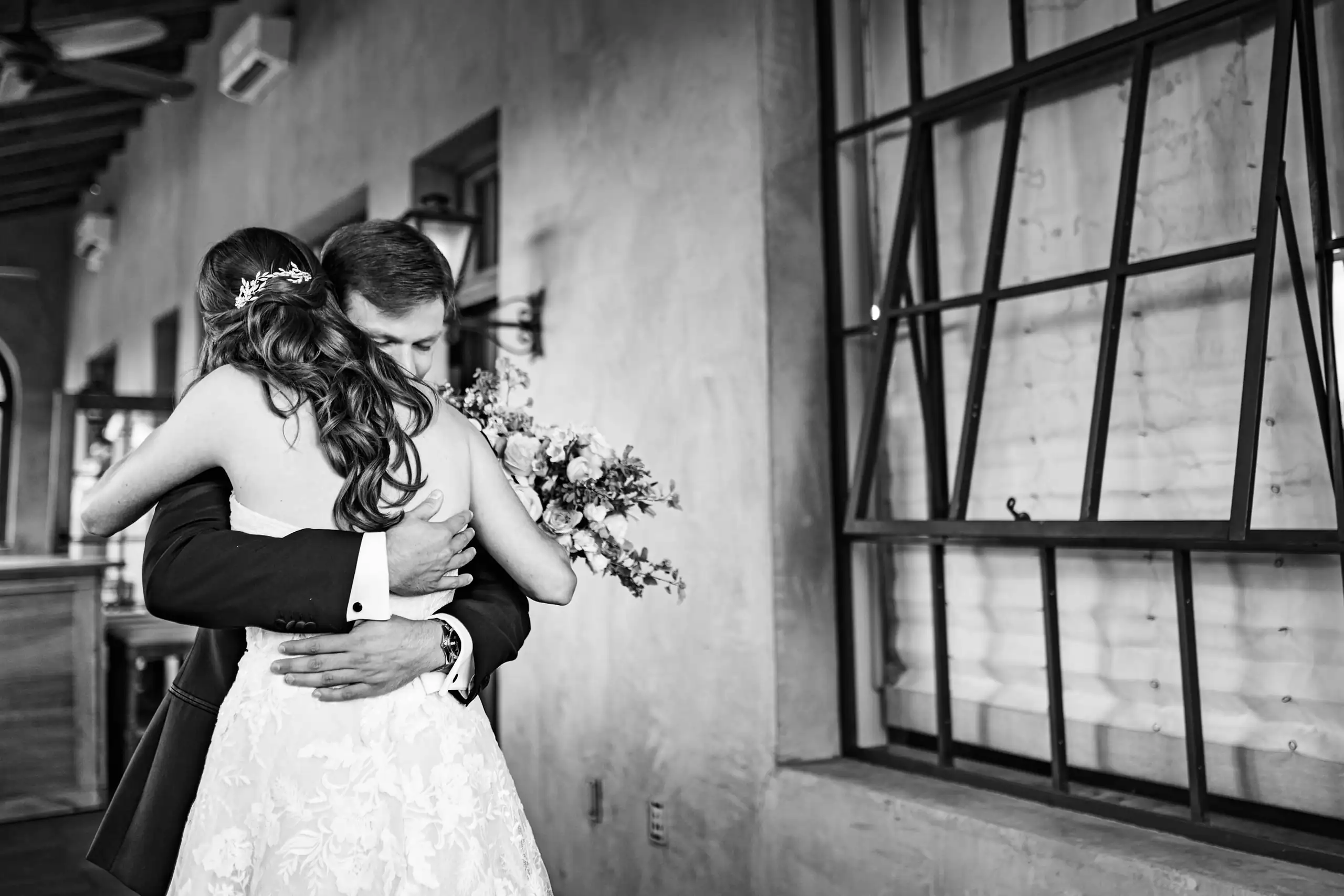 First Look: the couple embracing in black and white, before their wedding at Summerour Studio in Atlanta, GA