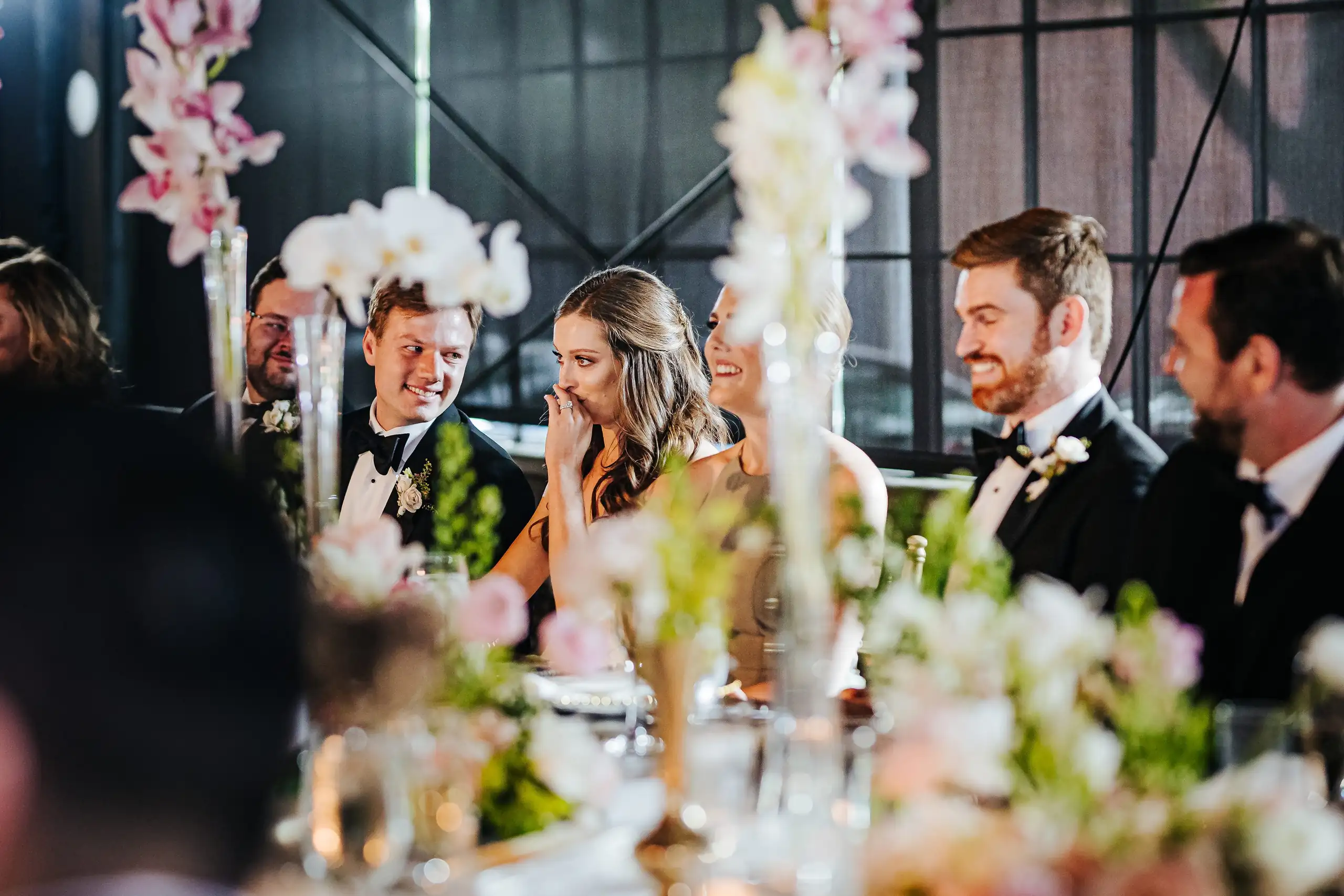 Wedding Reception: guests listening to a toast, at their wedding at Summerour Studio in Atlanta, GA