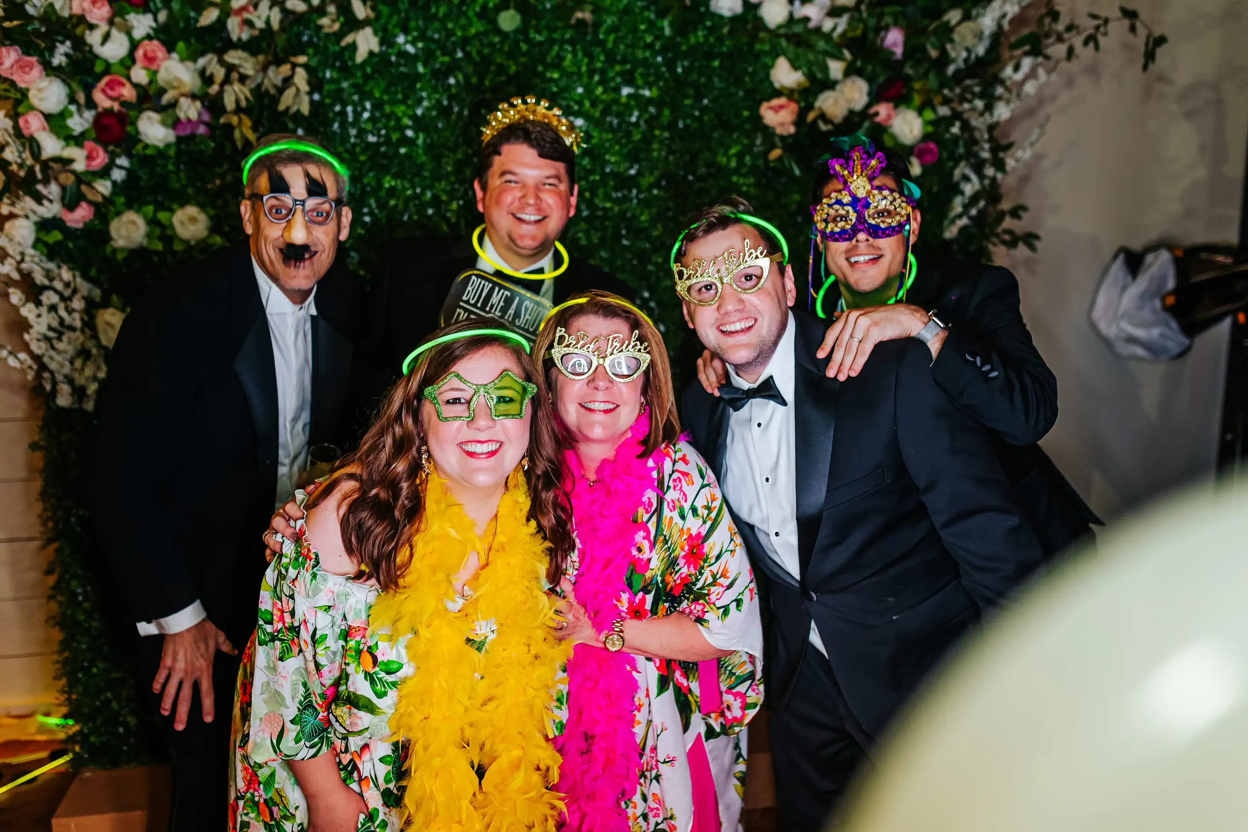Wedding Reception: guests in props at the photo wall, at their wedding at Summerour Studio in Atlanta, GA