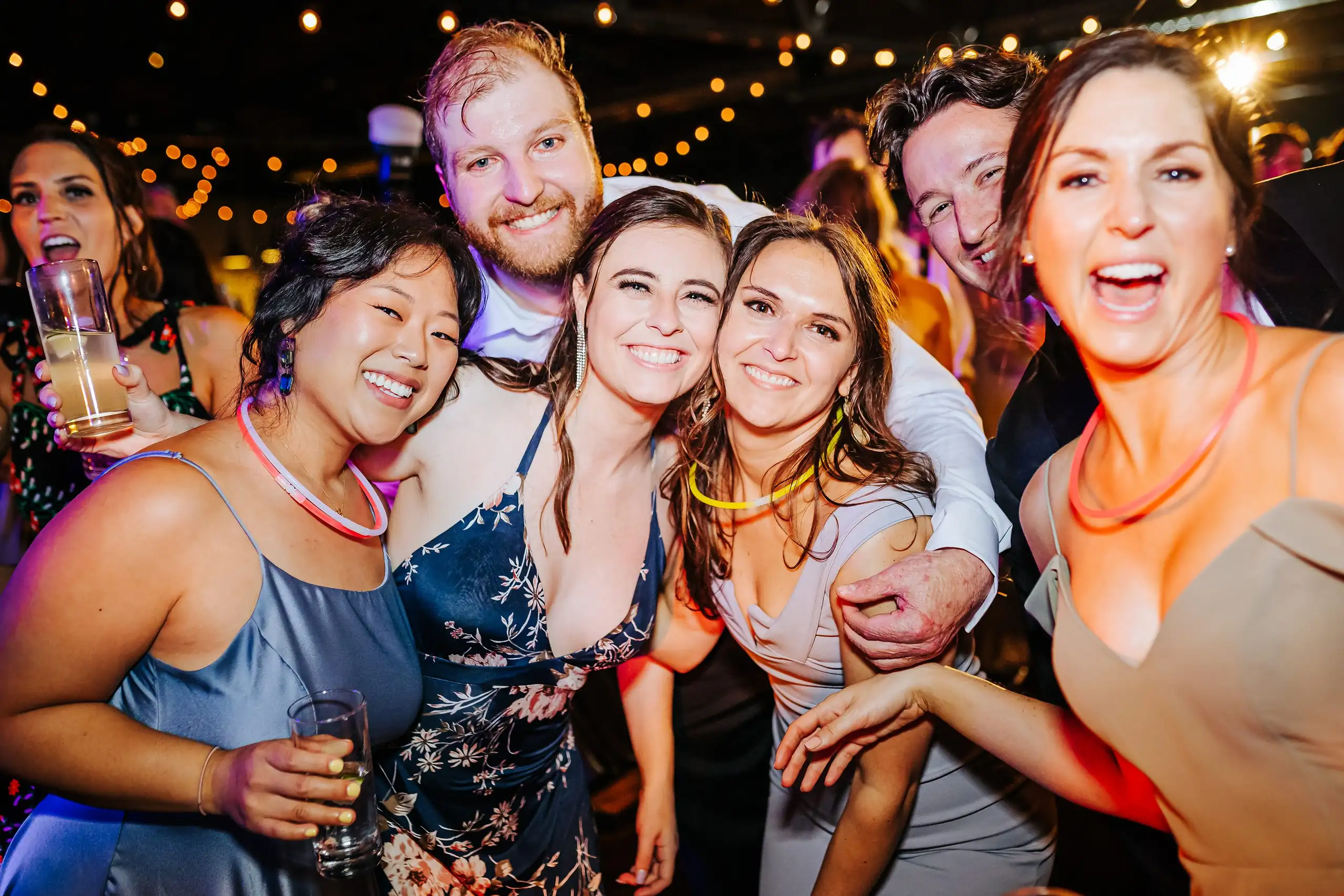 Wedding Reception: guests together on the dance floor, at their wedding at Summerour Studio in Atlanta, GA