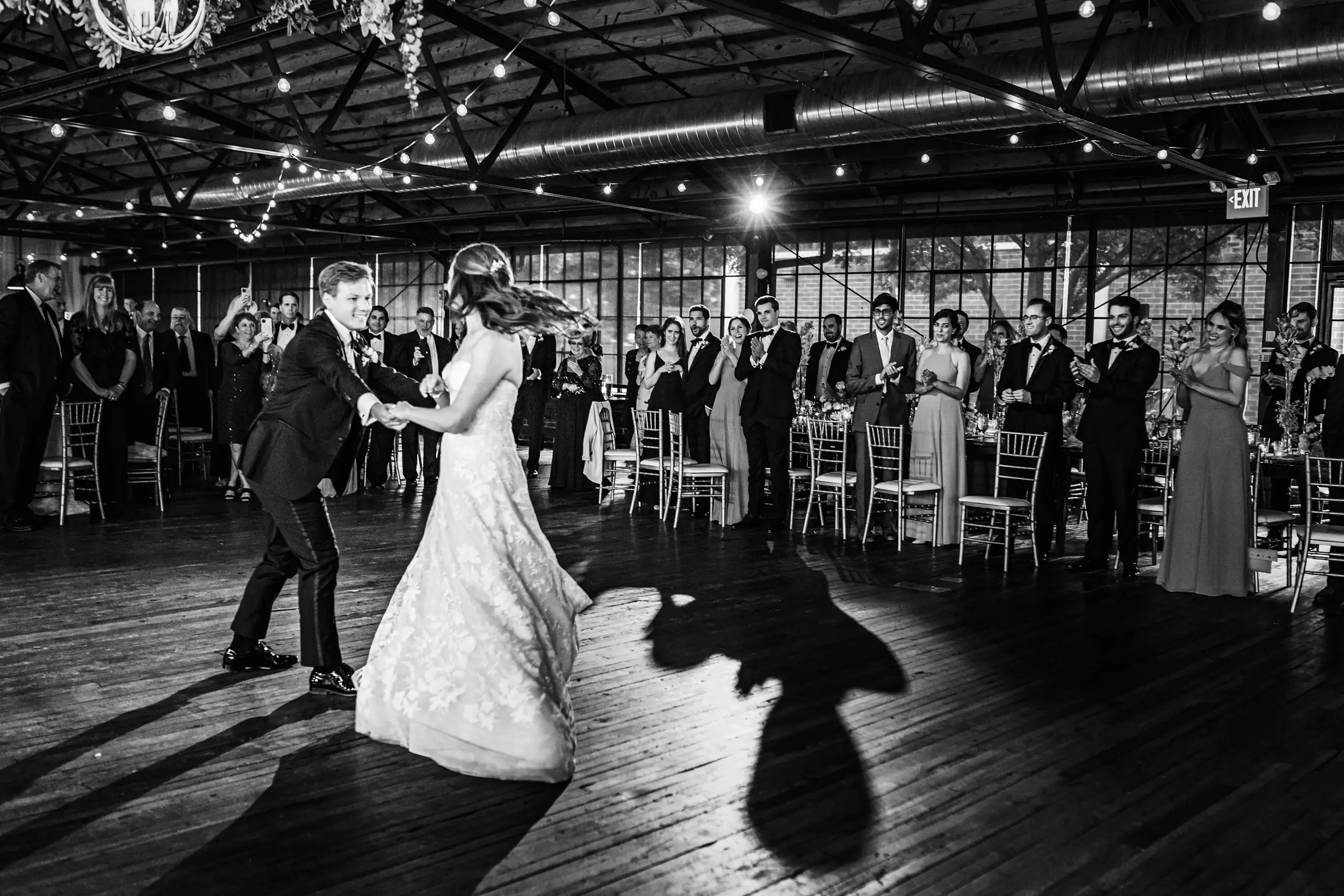 First Dance: the couple's first dance, in black and white, at their wedding at Summerour Studio in Atlanta, GA