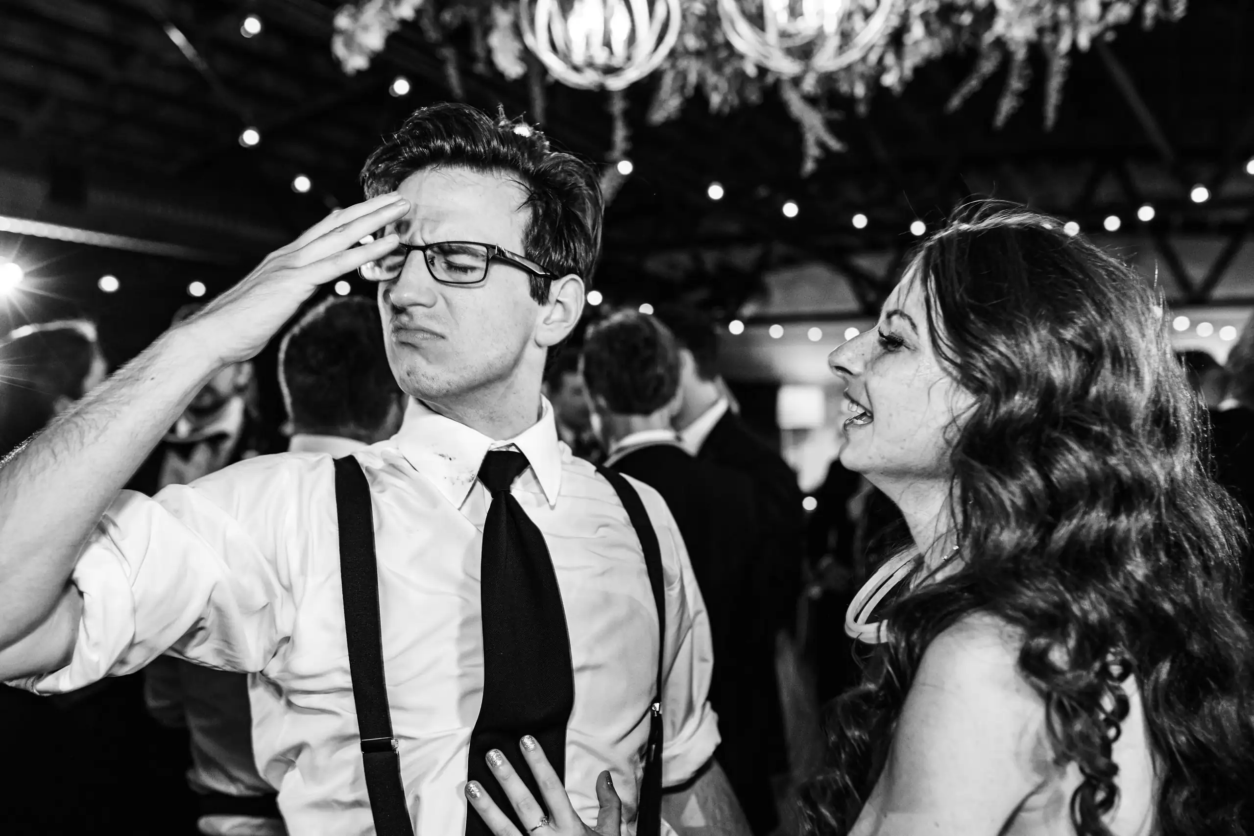 Wedding Reception: guests dancing, in black and white, at their wedding at Summerour Studio in Atlanta, GA