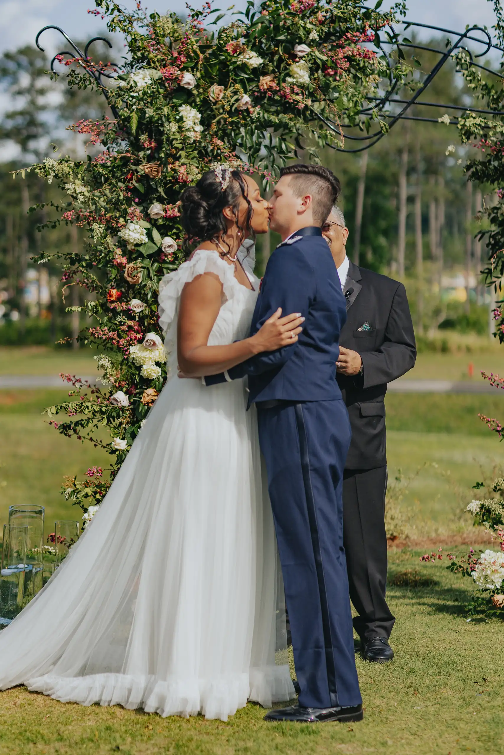 Wedding Ceremony: the first kiss under the roses, at their wedding at Callaway Gardens in Pine Mountain, GA