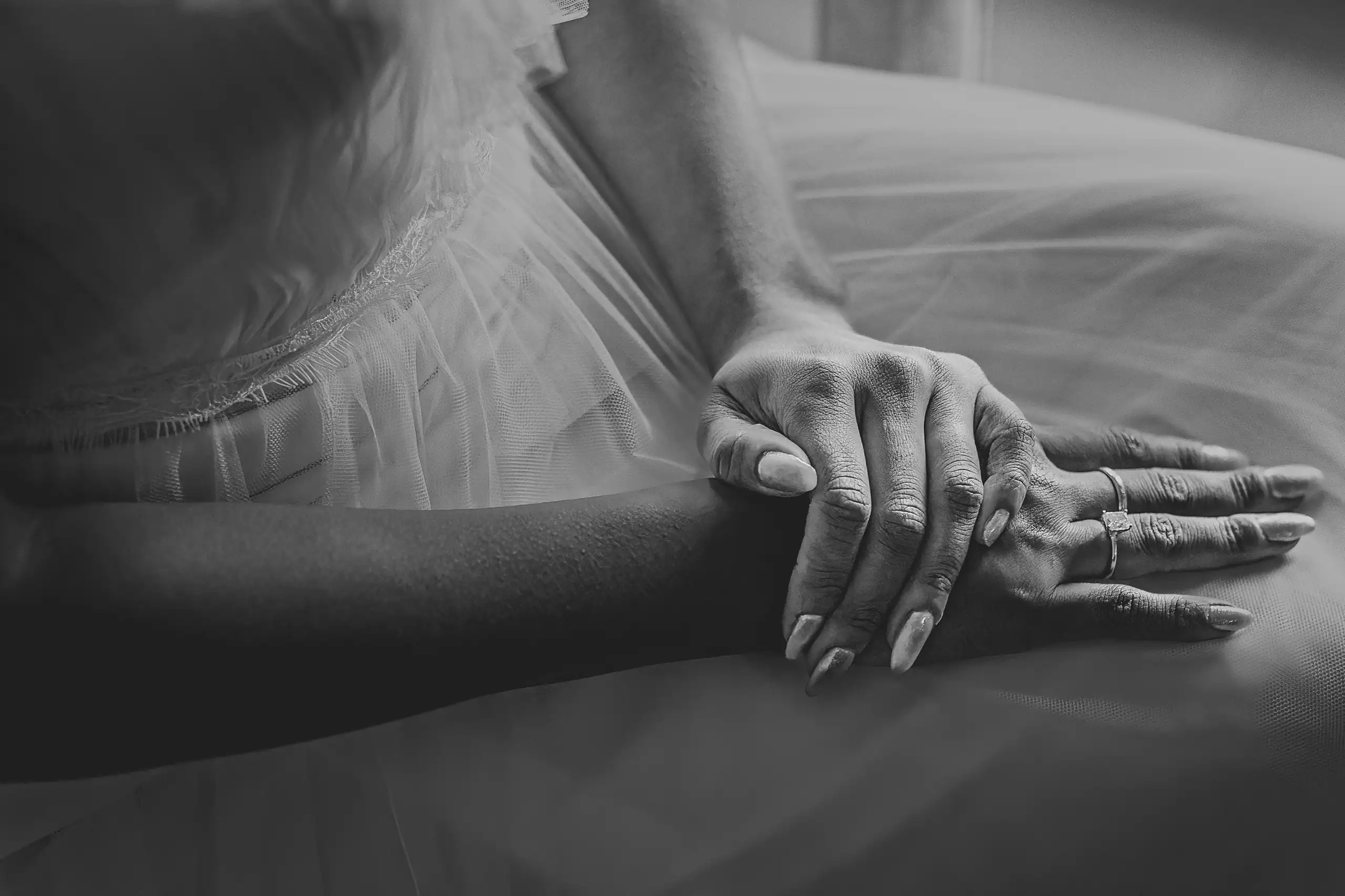 Getting Ready: her hands and rings resting on the gown, in black and white, before their wedding at Callaway Gardens in Pine Mountain, GA