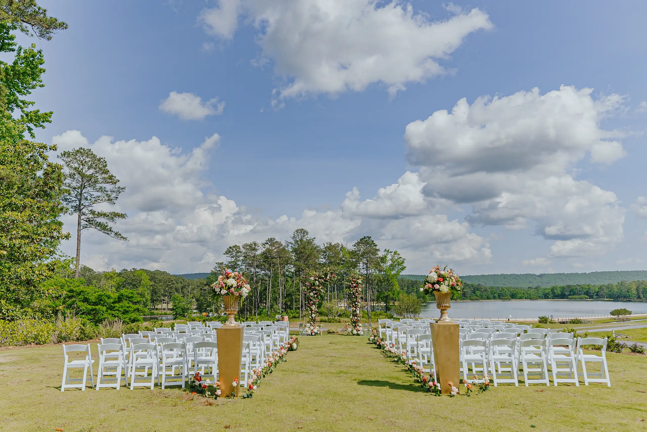 Wedding Ceremony: the chairs set out on the lawn above the lake, at a wedding at Callaway Gardens in Pine Mountain, GA