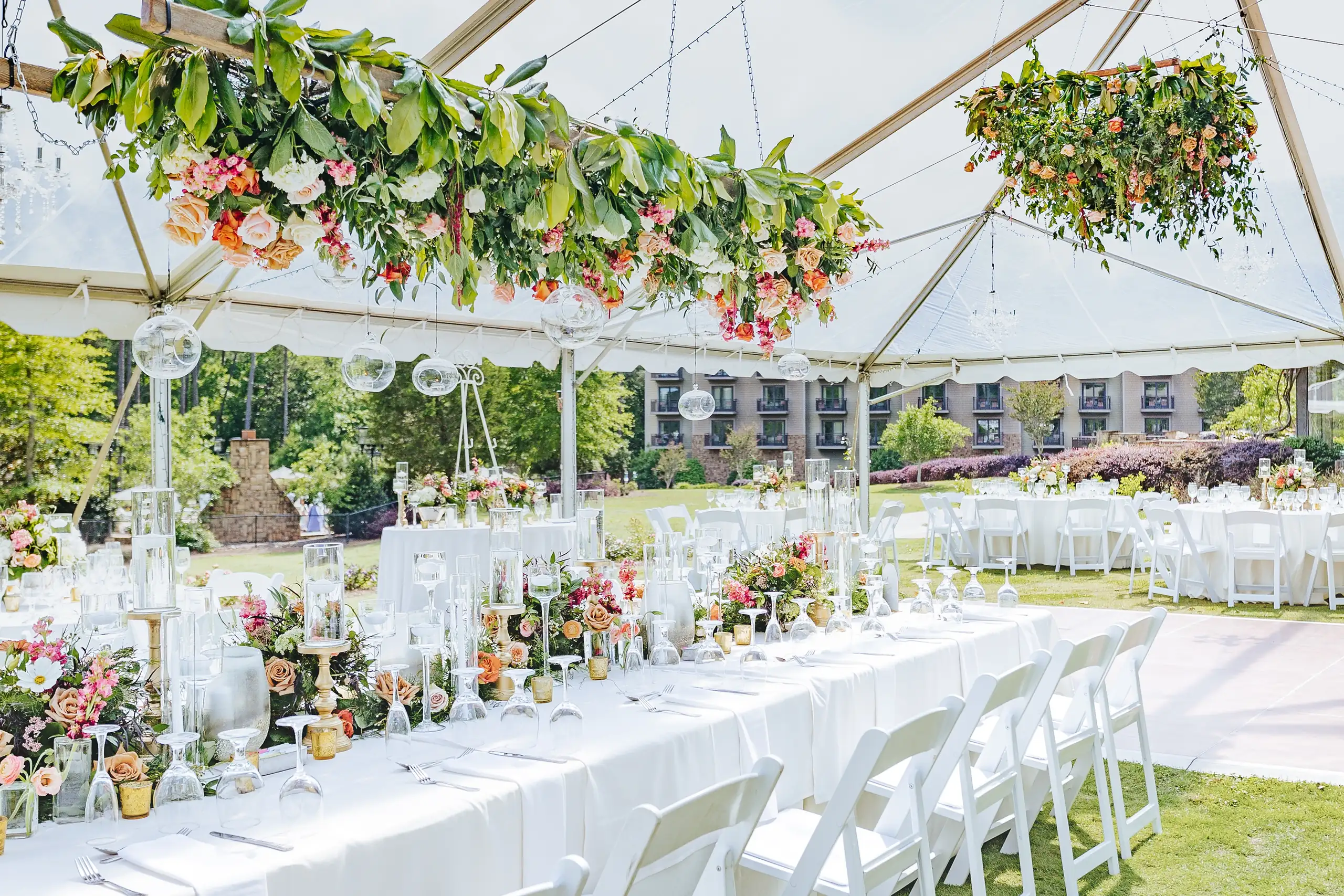 Reception Details: the whole tent laid out, greenery hung from the frame, at a wedding at Callaway Gardens in Pine Mountain, GA