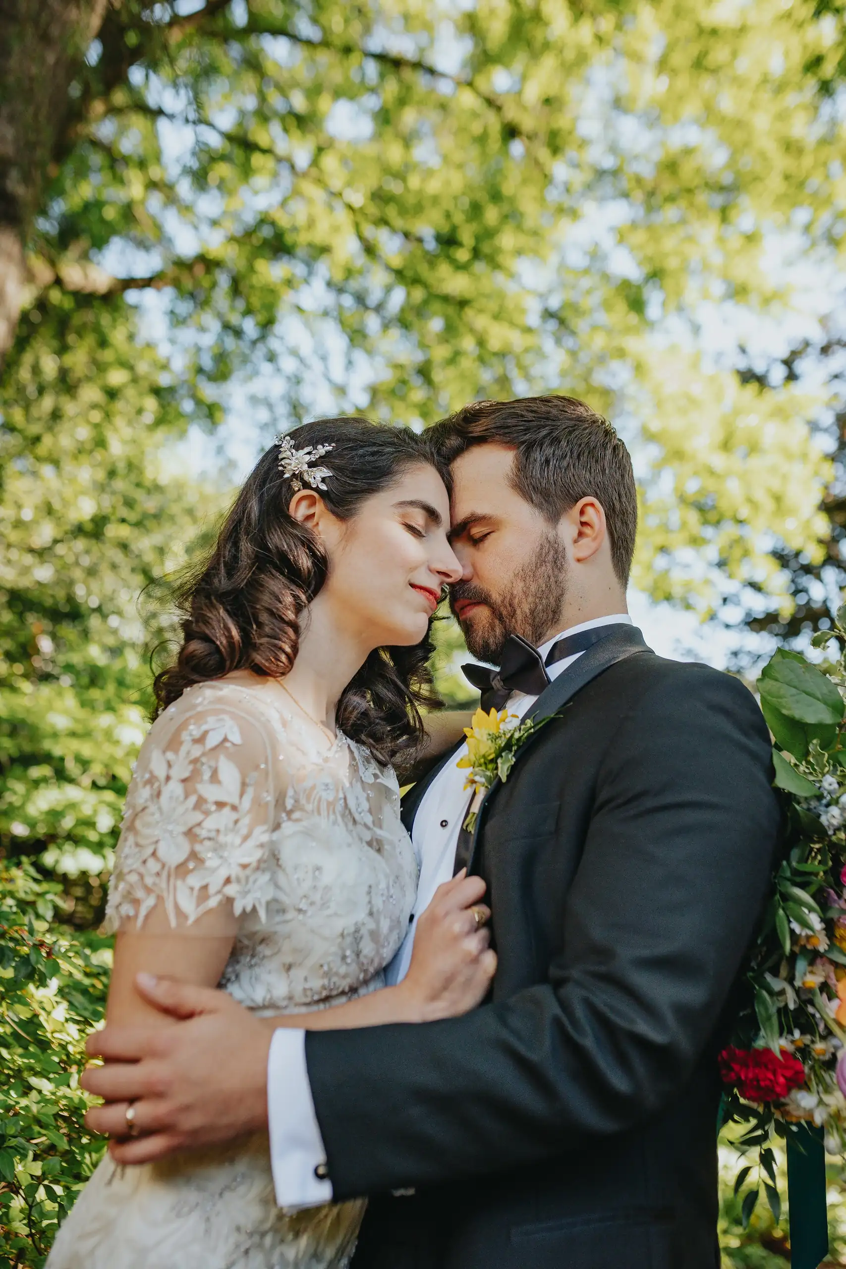 Wedding Formals: the couple close in the dappled light, at their wedding at the Trolley Barn in Atlanta, GA