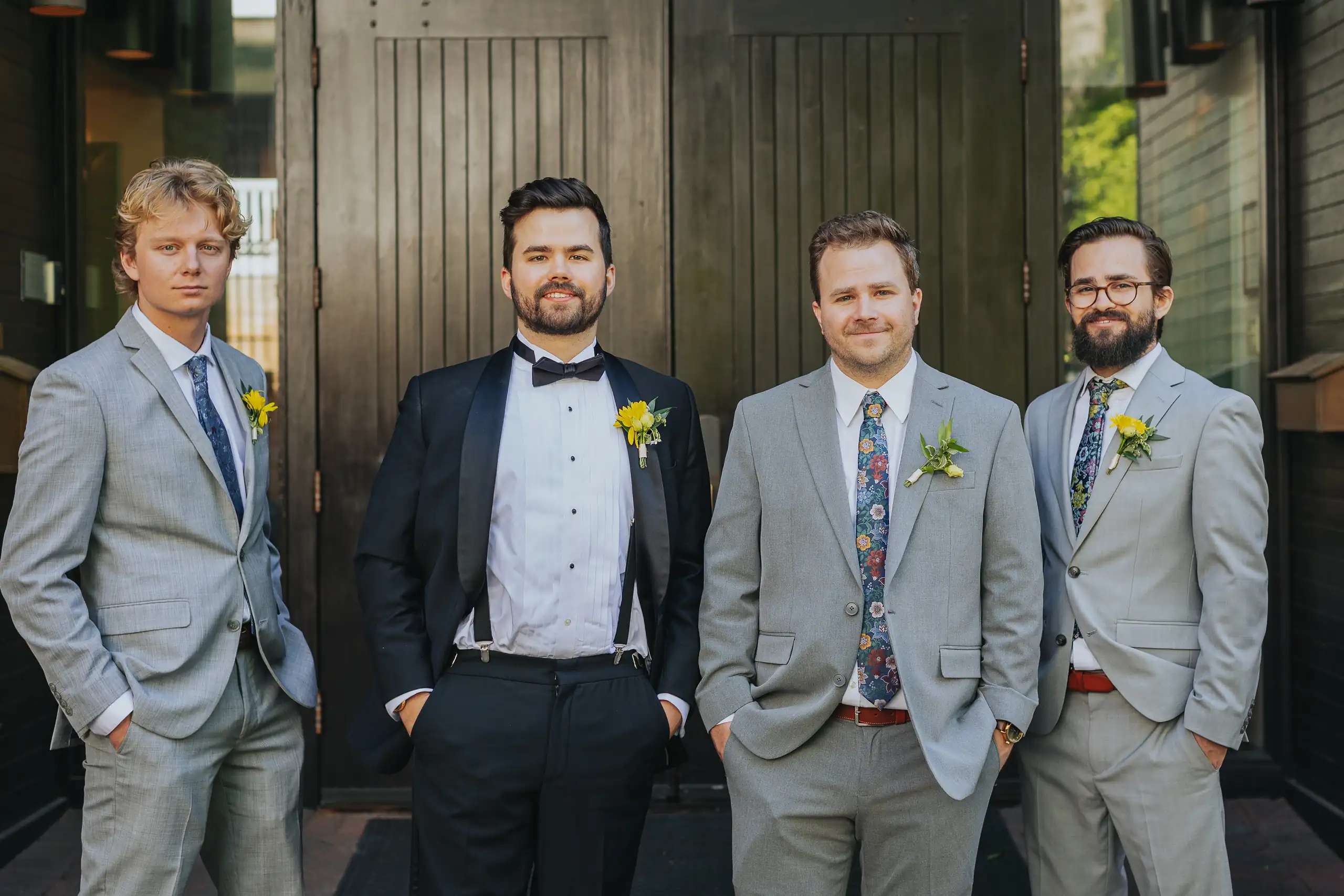 Wedding Party: the groom with his groomsmen in grey suits, at their wedding at the Trolley Barn in Atlanta, GA