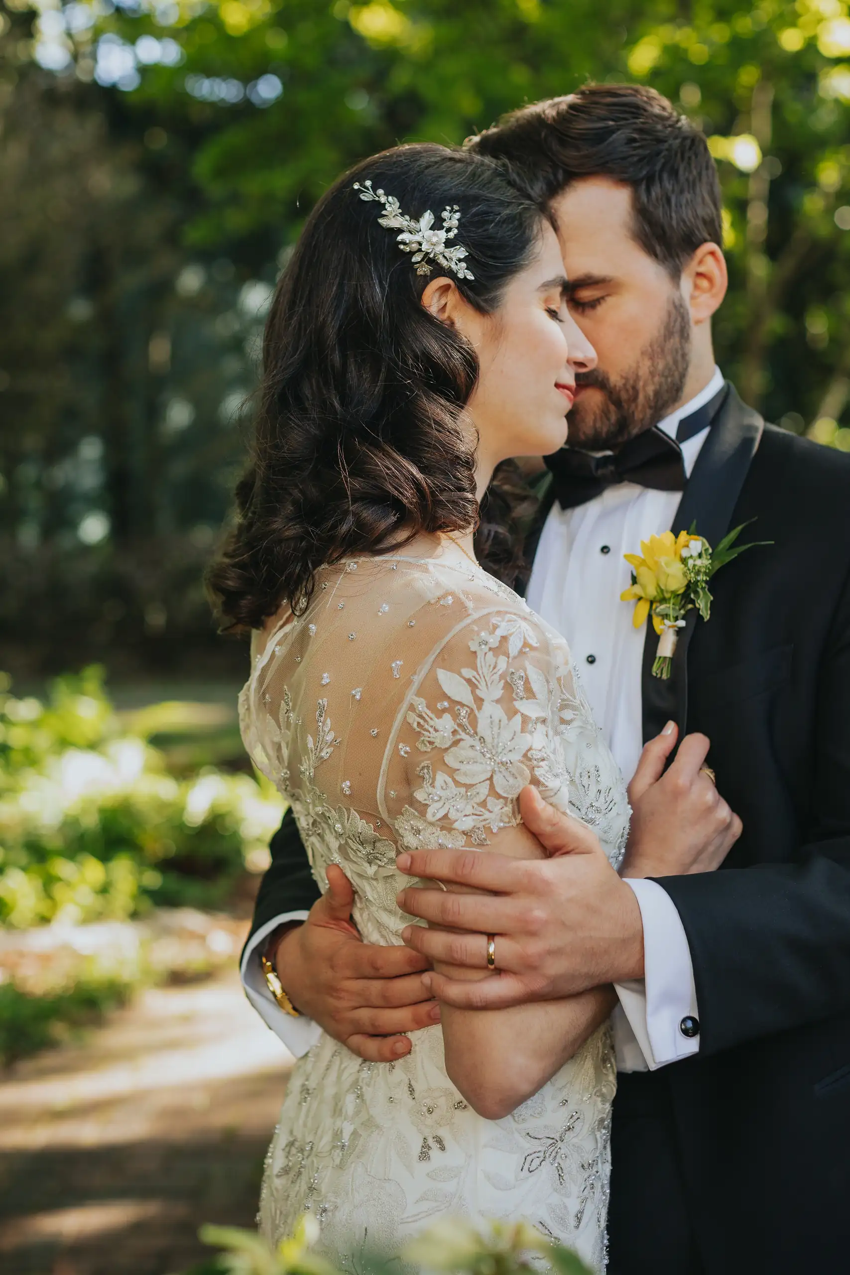 Wedding Formals: the couple kissing in the garden, at their wedding at the Trolley Barn in Atlanta, GA