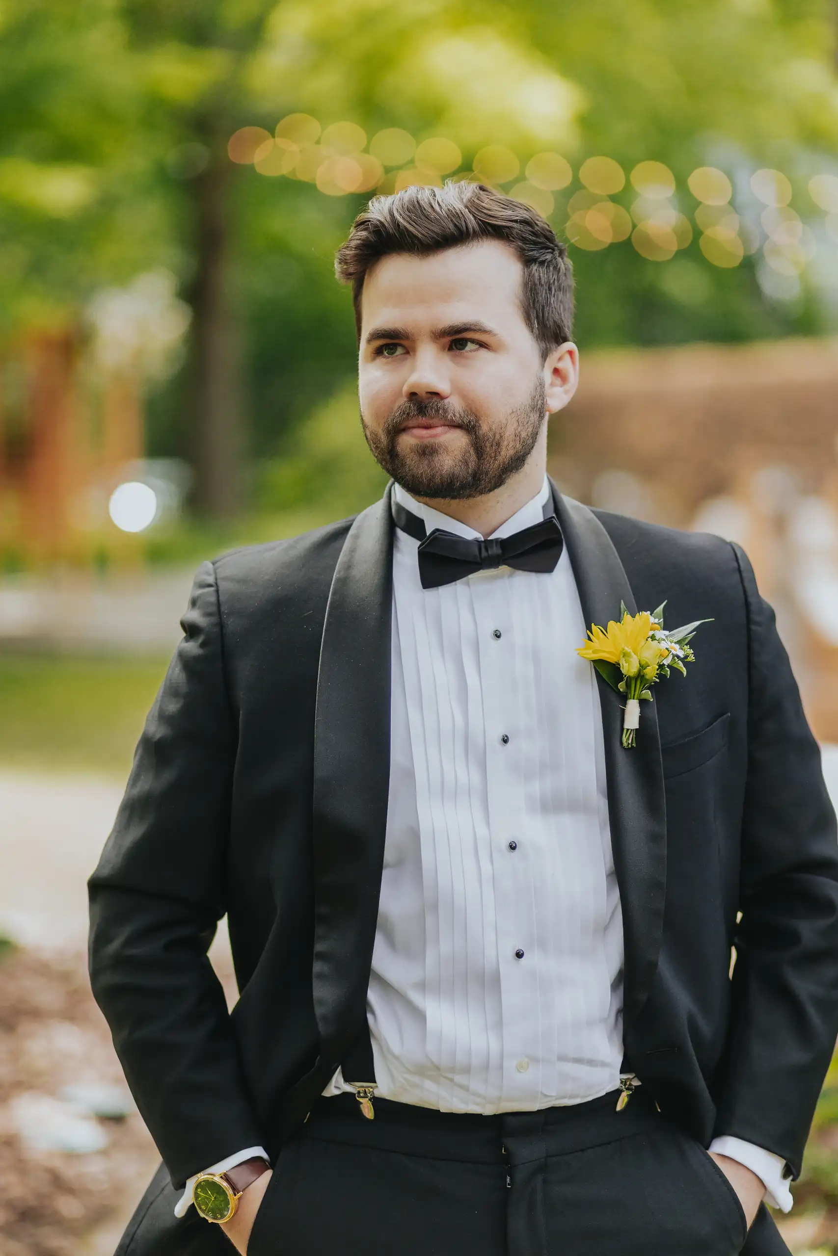 Wedding Formals: the groom in his tuxedo with a yellow boutonniere, at their wedding at the Trolley Barn in Atlanta, GA