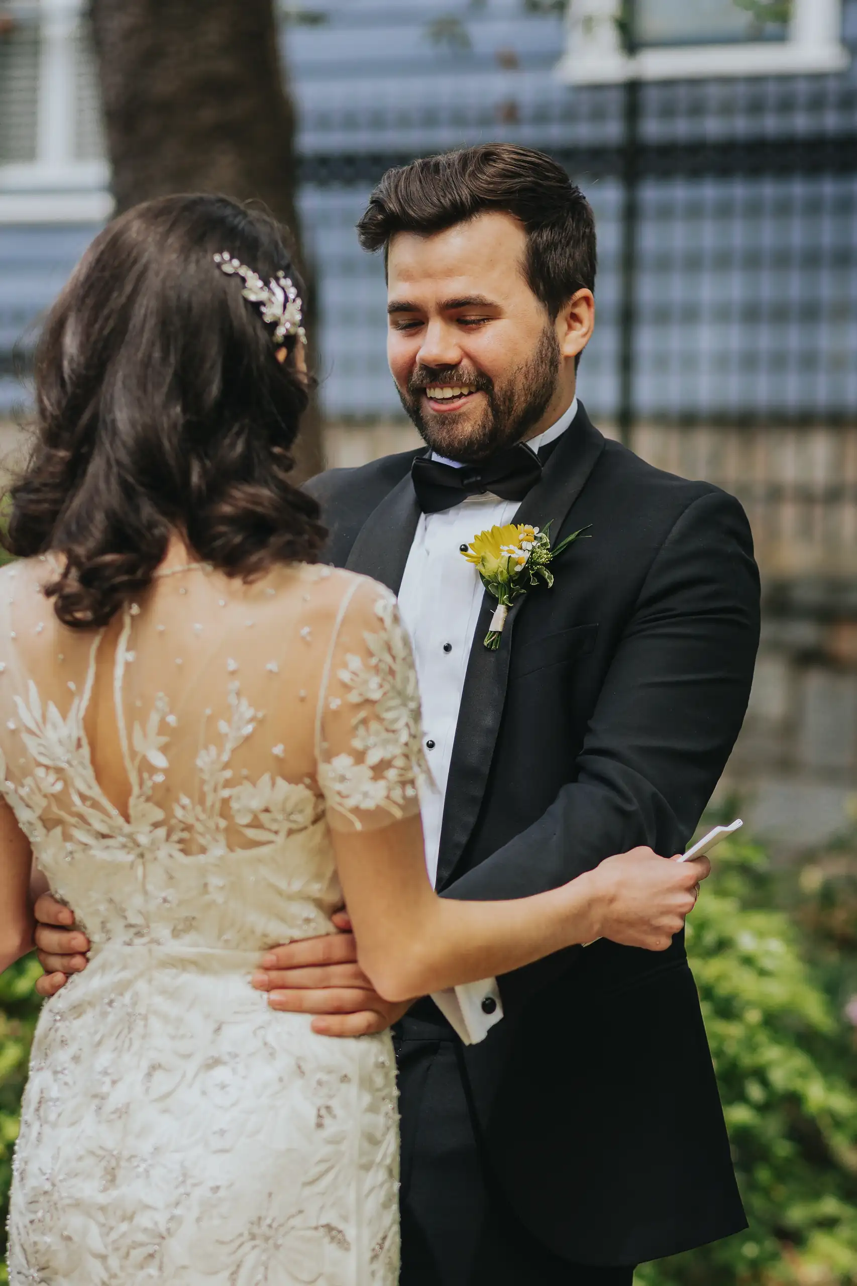 First Look: the couple embracing as he reads to her, before their wedding at the Trolley Barn in Atlanta, GA