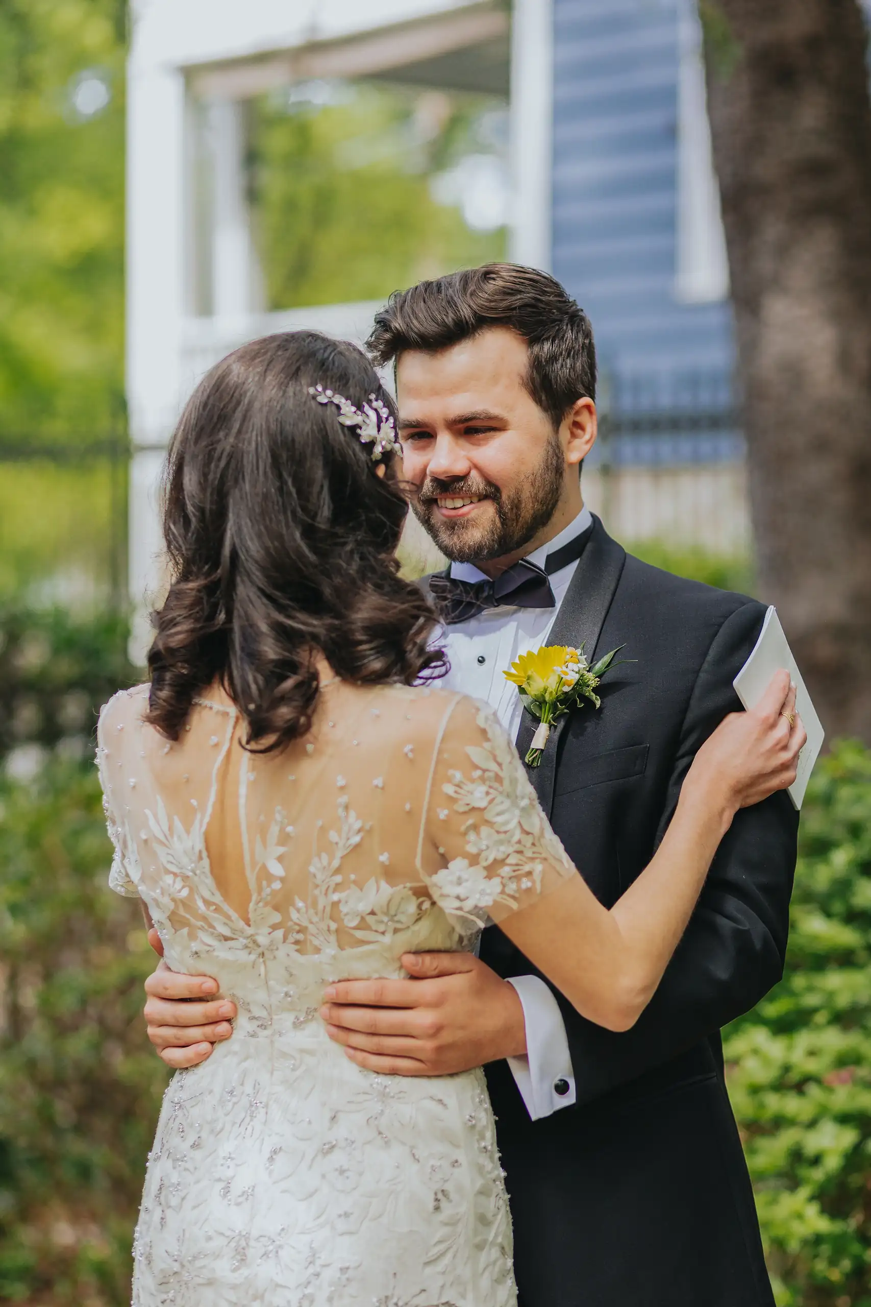 First Look: the couple holding each other after their vows, before their wedding at the Trolley Barn in Atlanta, GA