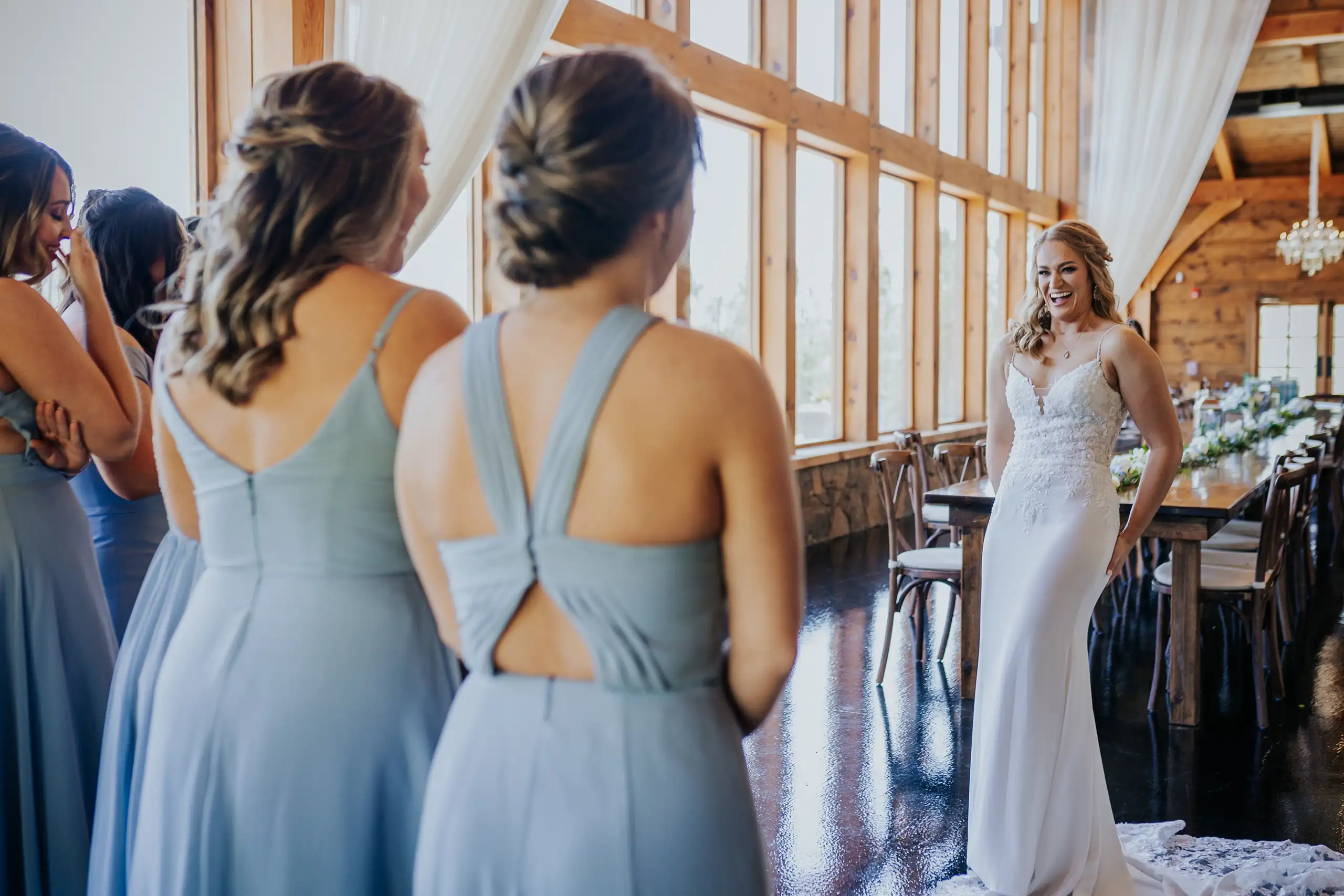 Wedding Party: the bride with her bridesmaids in dusty blue, at their wedding at The Venue at Sharp Mountain in Jasper, GA