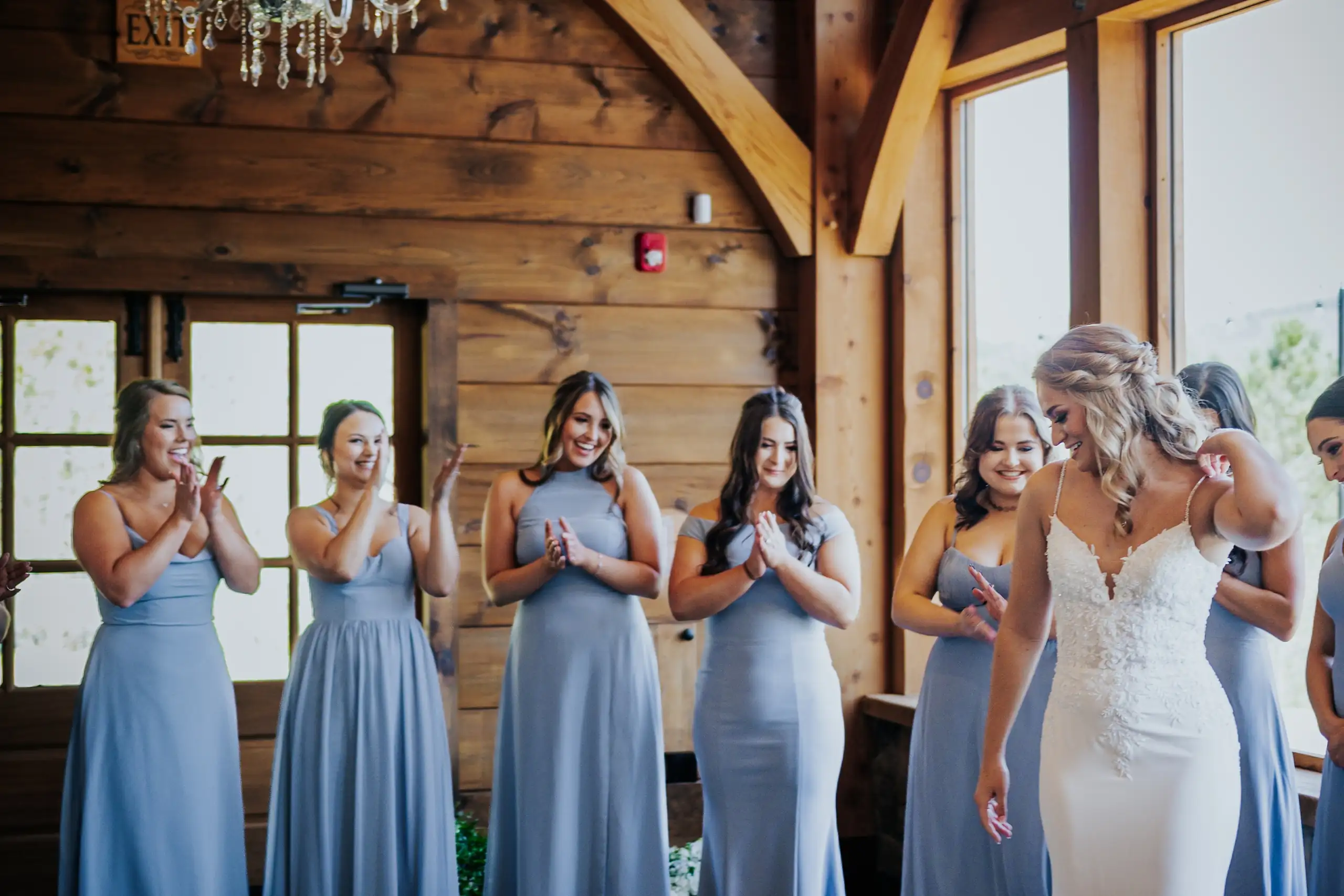 First Look: the bridesmaids applauding as she turns, before their wedding at The Venue at Sharp Mountain in Jasper, GA