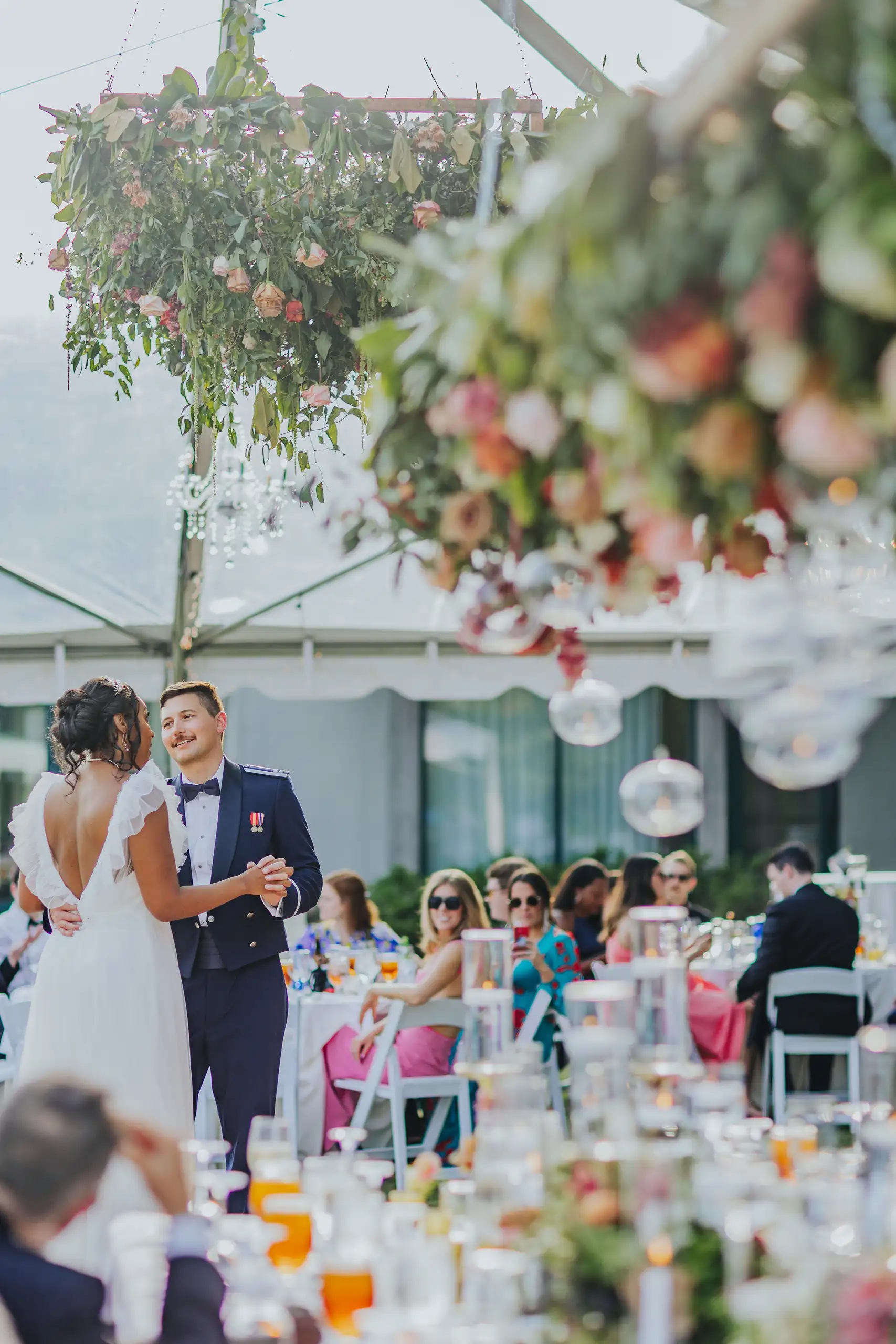 Wedding Reception: the couple dancing under the hanging florals, at their wedding at Callaway Gardens in Pine Mountain, GA