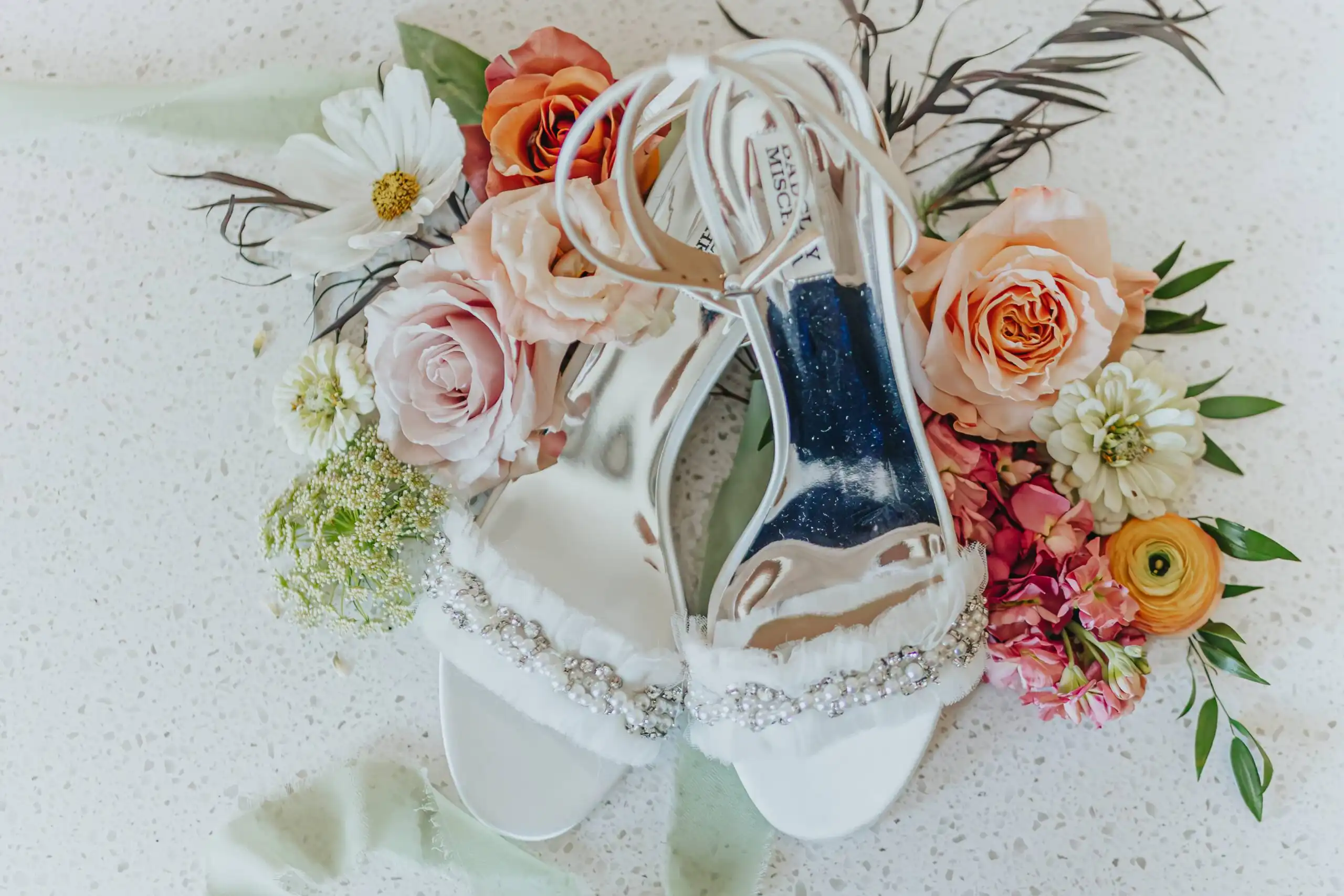 Wedding Details: her jewelled heels among the coral and blush blooms, at a wedding at Callaway Gardens in Pine Mountain, GA