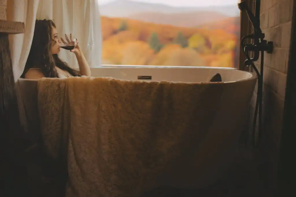 Atlanta Wedding Photographer photographs bride in tub in Georgia Mountains