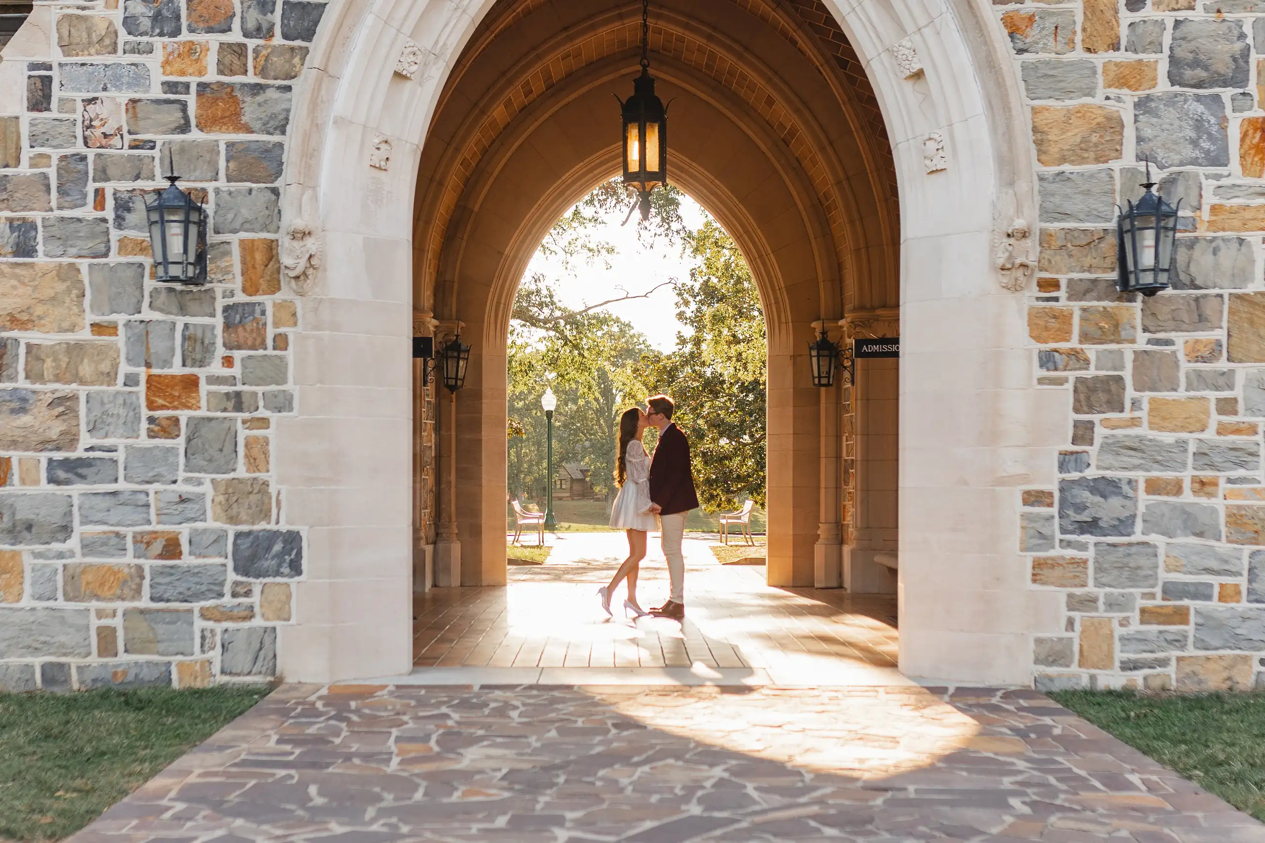 Engagement Portraits: the two of them framed in the stone gothic arch, during their engagement session at Berry College in Rome, GA
