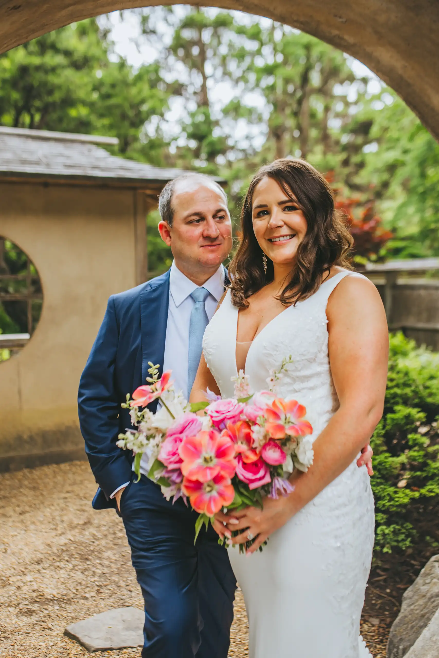 Wedding Formals: the couple framed in the stone archway, at their wedding