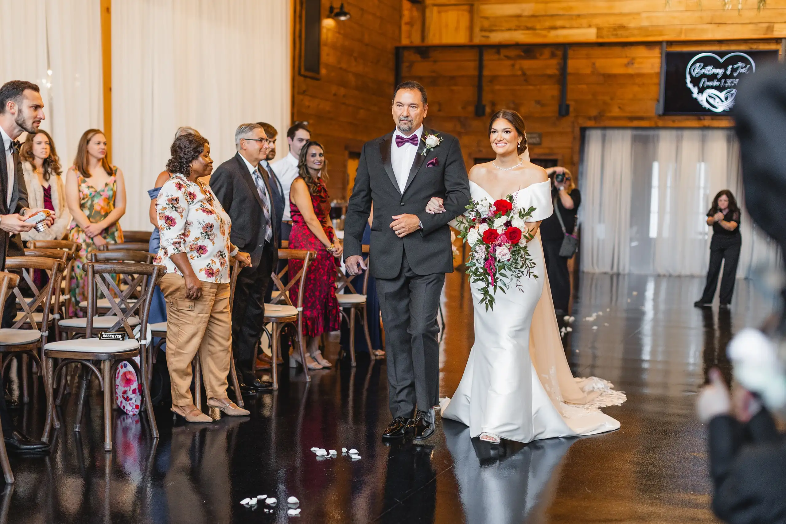 Processional: her father bringing her up the aisle indoors, at their wedding at The Venue at Sharp Mountain in Jasper, GA