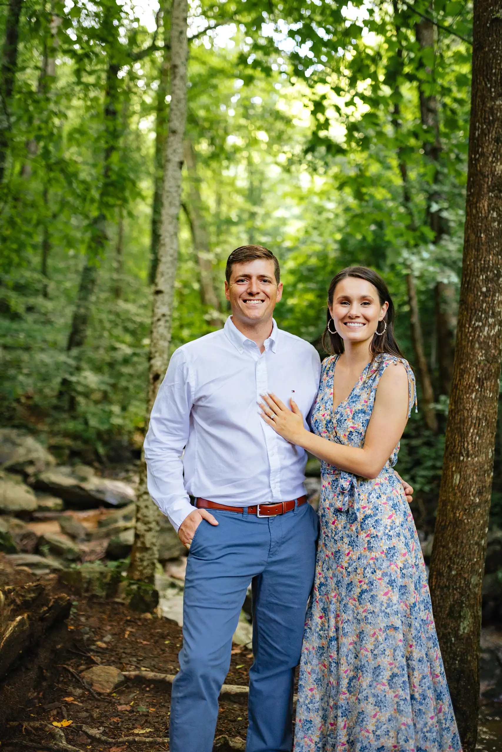 Engagement Portraits: the two of them standing in the green woods, at their engagement session at Amicalola Falls in Dawsonville, GA