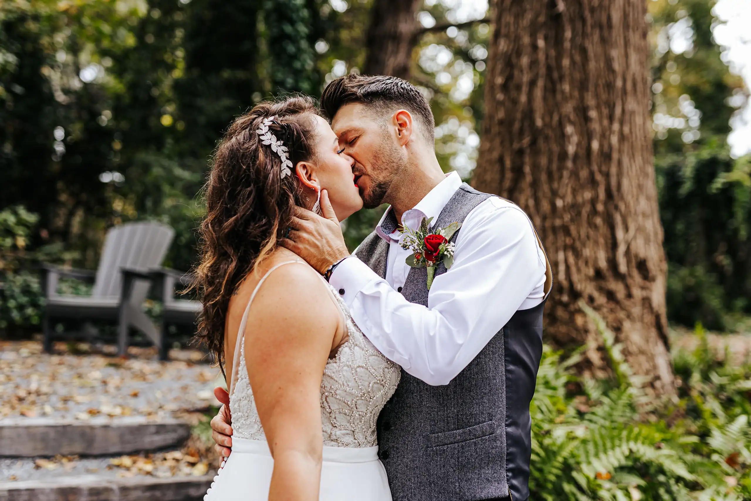 Wedding Formals: the two of them kissing under the big tree, at their wedding at Bold Monk Brewery in Atlanta, GA