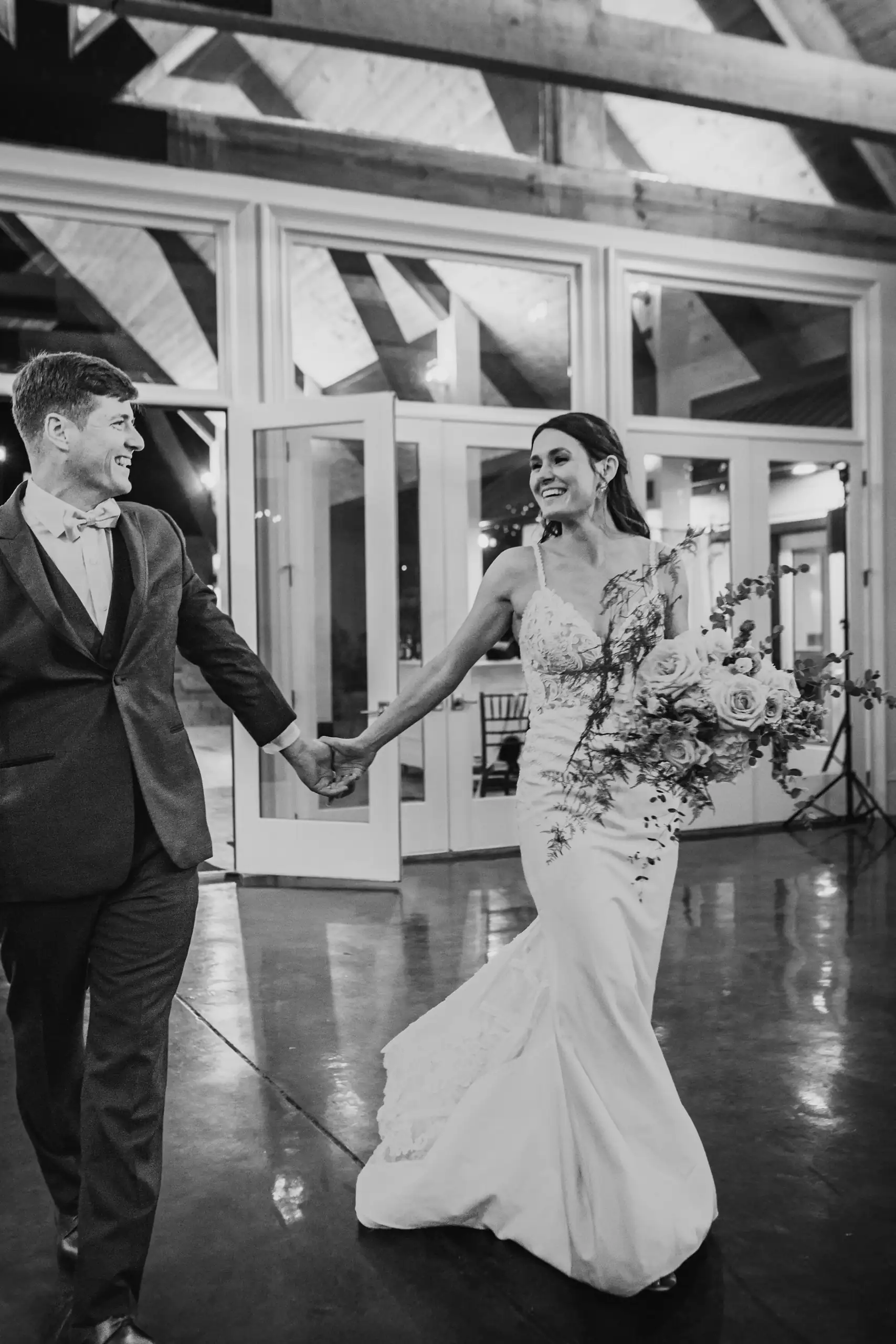 Wedding Formals: the two of them on the wet terrace, in black and white, at their wedding at Swan Lake Overlook in Dawsonville, GA